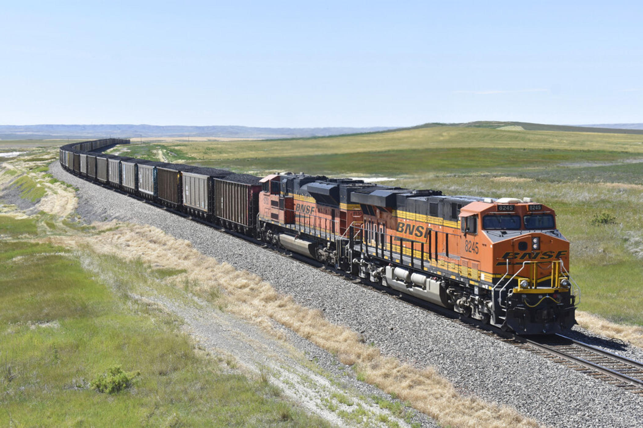 A BNSF railroad train hauling carloads of coal from the Powder River Basin of Montana and Wyoming is seen east of Hardin, Mont., on July 15, 2020. Business and top officials are bracing for the possibility of a nationwide rail strike on Friday, Sept. 16, 2022, while talks continue between the nation's largest freight railroads and their unions.
