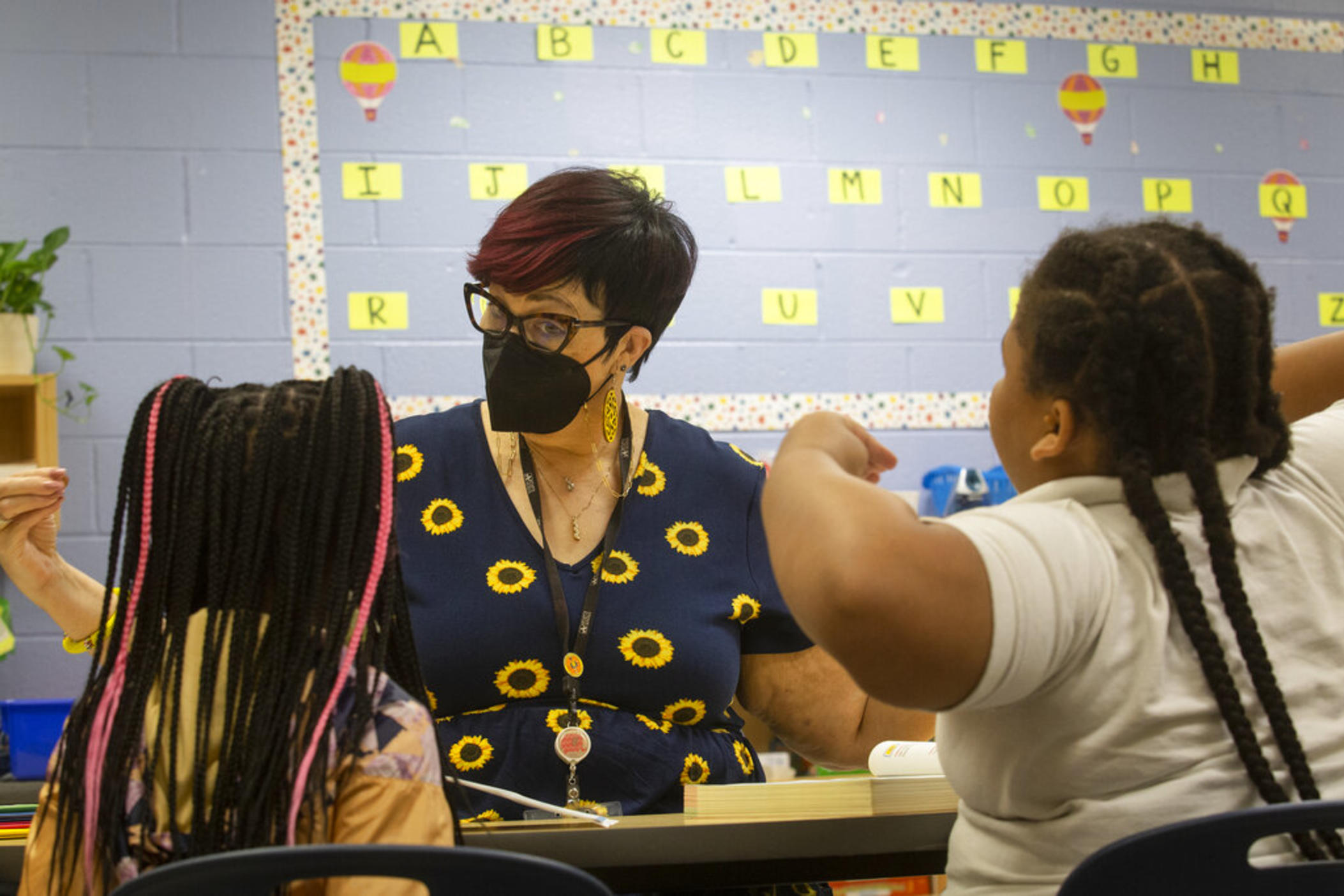 Third-grade students take part in a small group reading session at Beecher Hills Elementary School on Friday, Aug. 19, 2022, in Atlanta. Mounting evidence shows that students who took part in remote learning during the coronavirus pandemic lost about half of an academic year of learning.