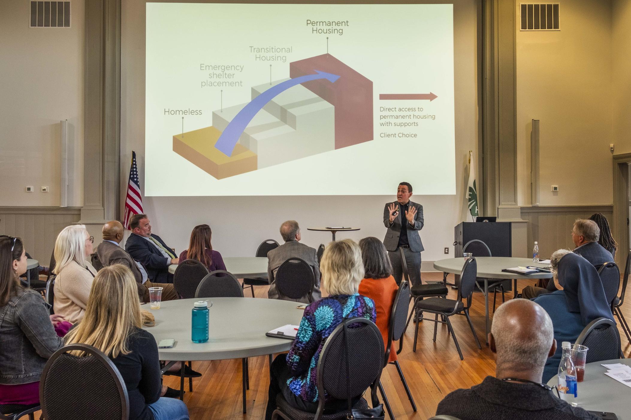 Consultant and advocate for the homeless Andrae Bailey explains the concept of "Housing First" to non-profit leaders in Macon recently.