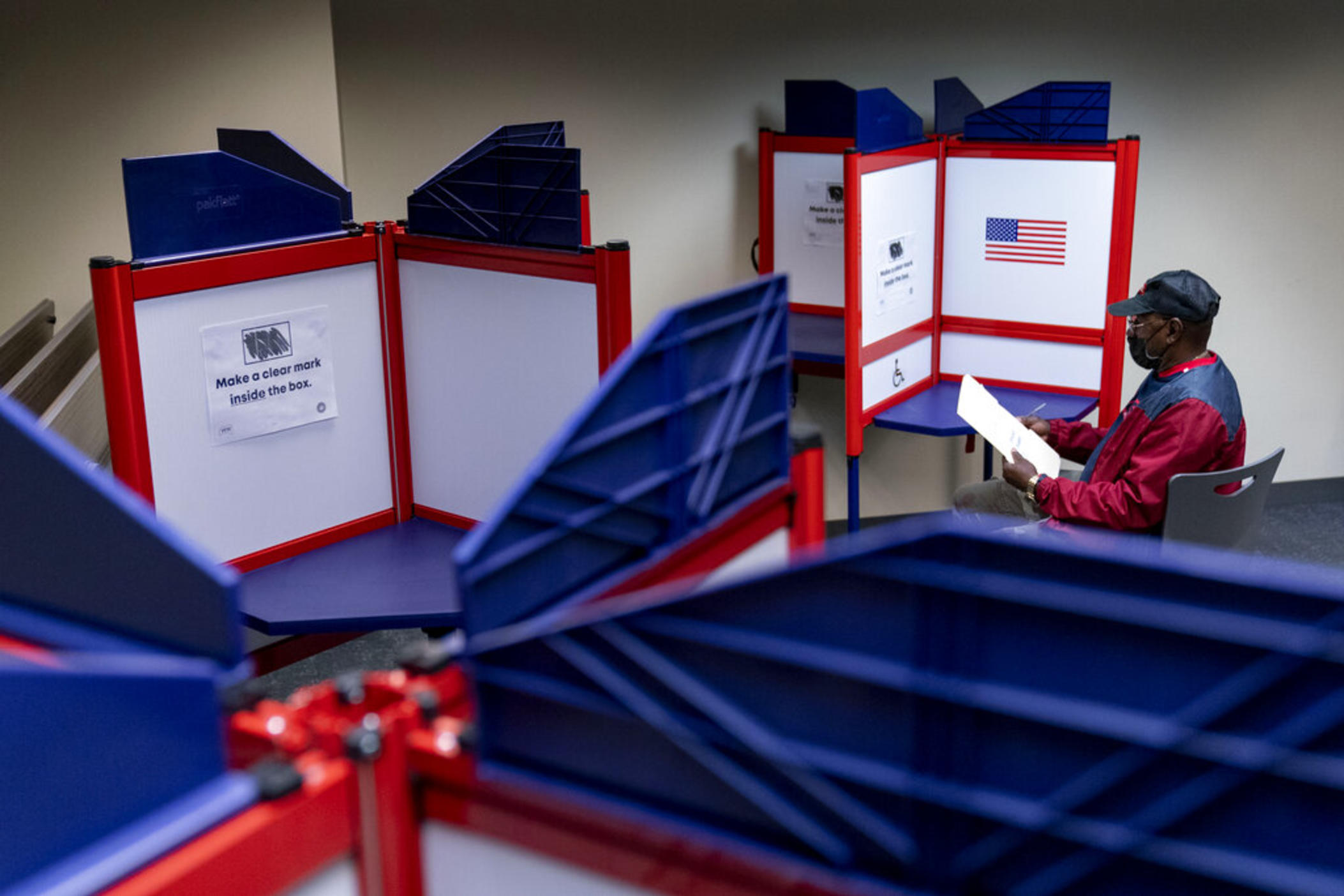 Cornelius Whiting fills out his ballot at an early voting location in Alexandria, Va., on Sept. 26, 2022. Republican activists who believe the 2020 election was stolen from former President Donald Trump have crafted a plan that, in their telling, will thwart cheating in this year’s midterm elections. 
