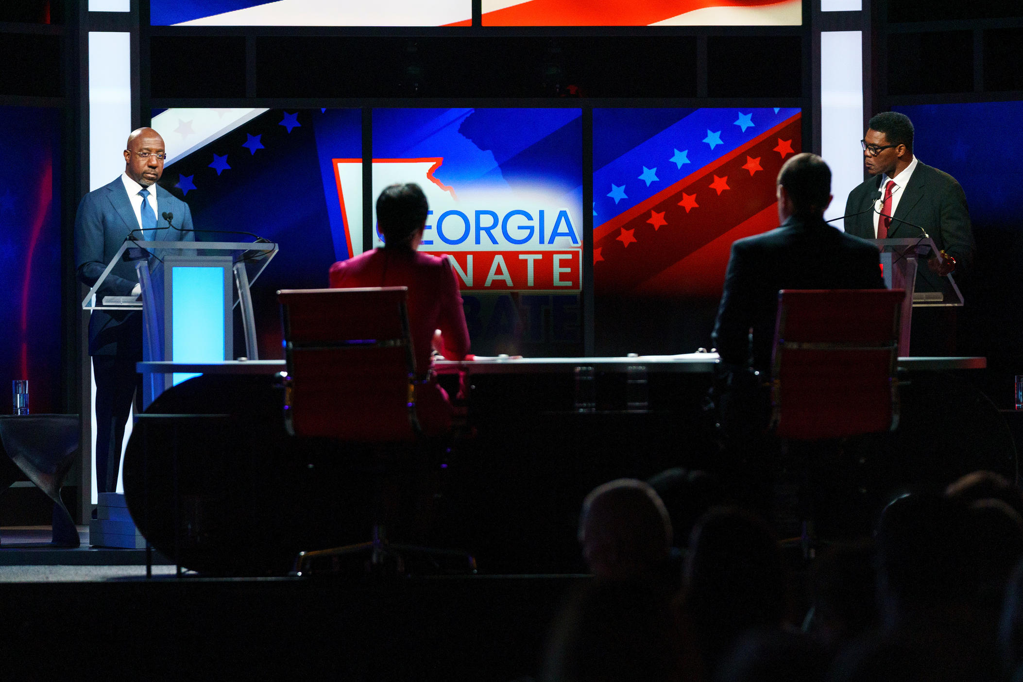 Sen. Raphael Warnock and Herschel Walker appear at a debate in Savannah.