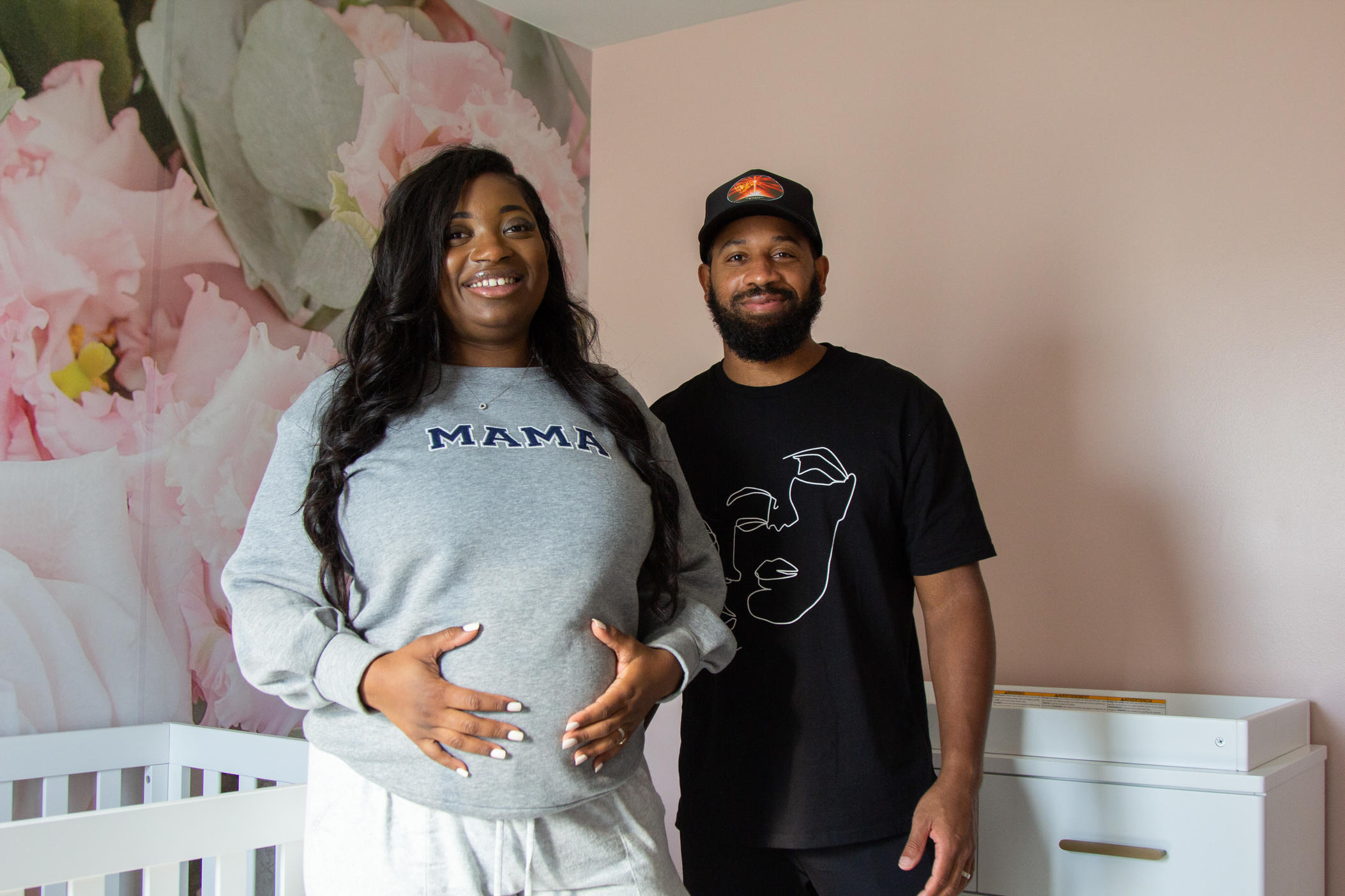 Dejerica and Derick Tinsley stand in the baby nursery at their home in Marietta, Ga., on Oct. 9, 2022. The Tinsleys worked with doula Chanel Stryker-Boykin throughout Dejerica's pregnancy.
