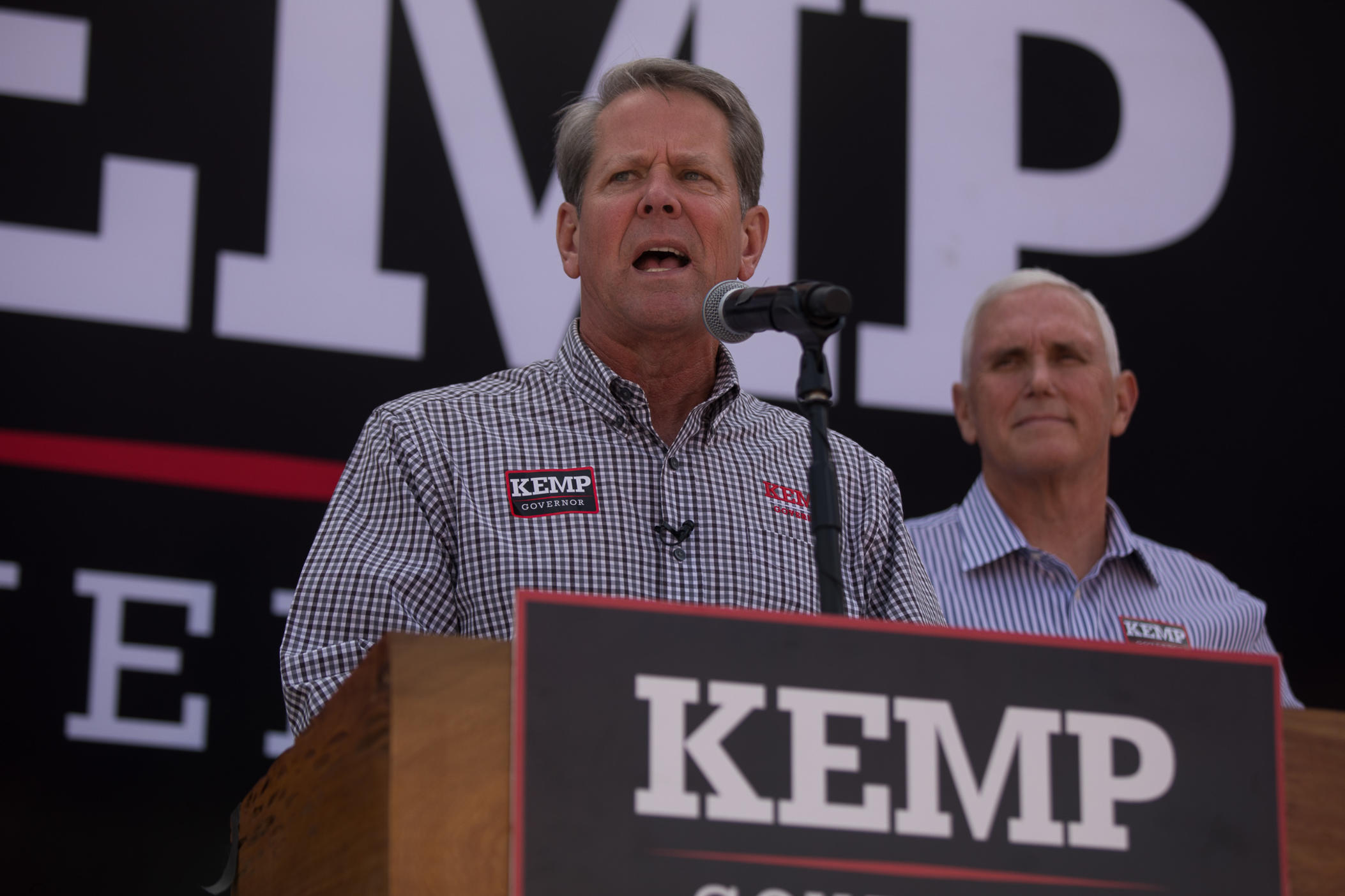 Gov. Brian Kemp campaigns with former Vice President Mike Pence in Cumming, Ga. Nov. 1, 2022.