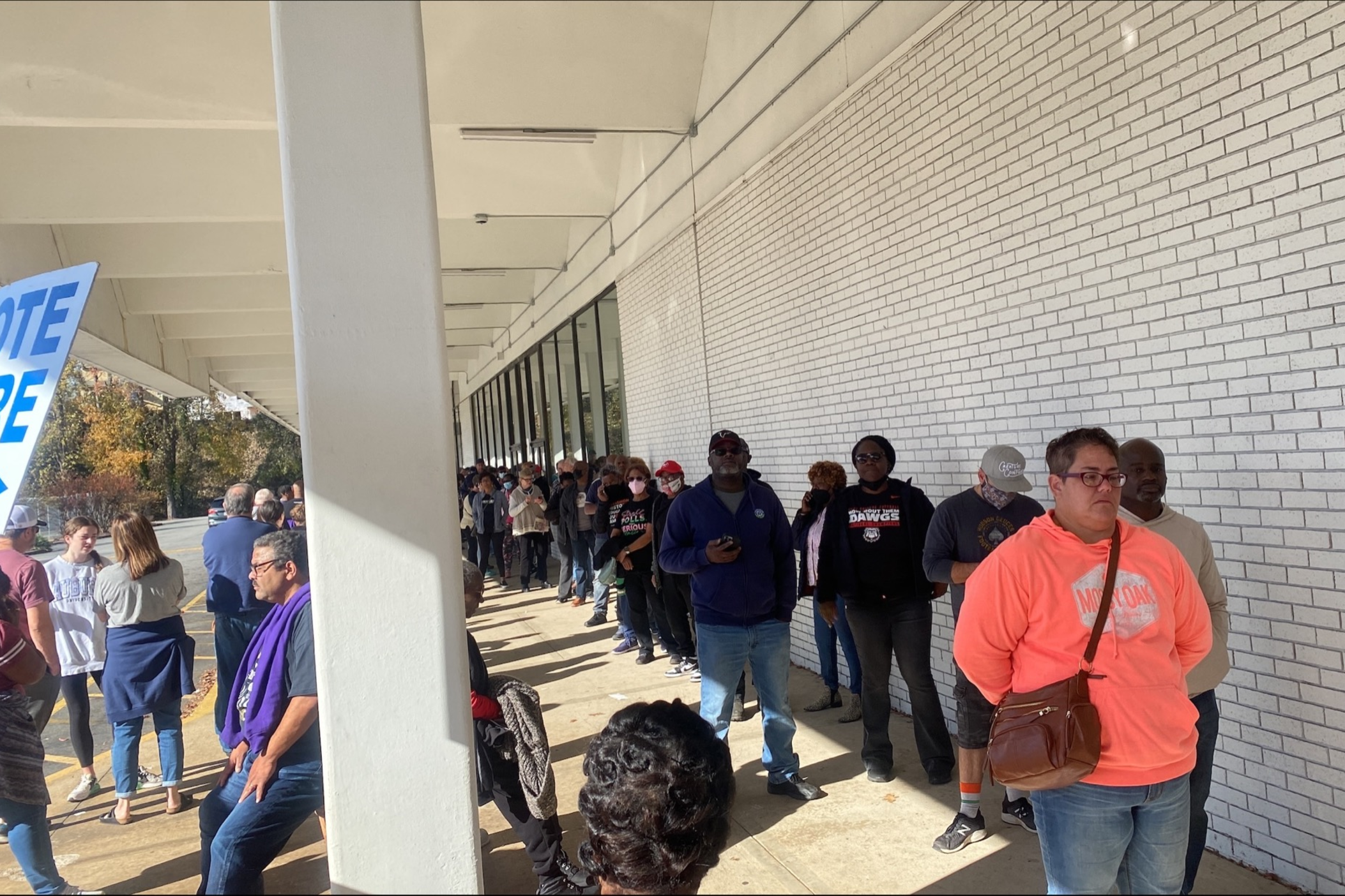 Voters in Dekalb County wait in line at a polling place on Saturday, Nov. 26, 2022 to cast their ballots in the runoff election for U.S. Senate between incumbent Democratic Se. Raphael Warnock and Republican challenger Herschel Walker.