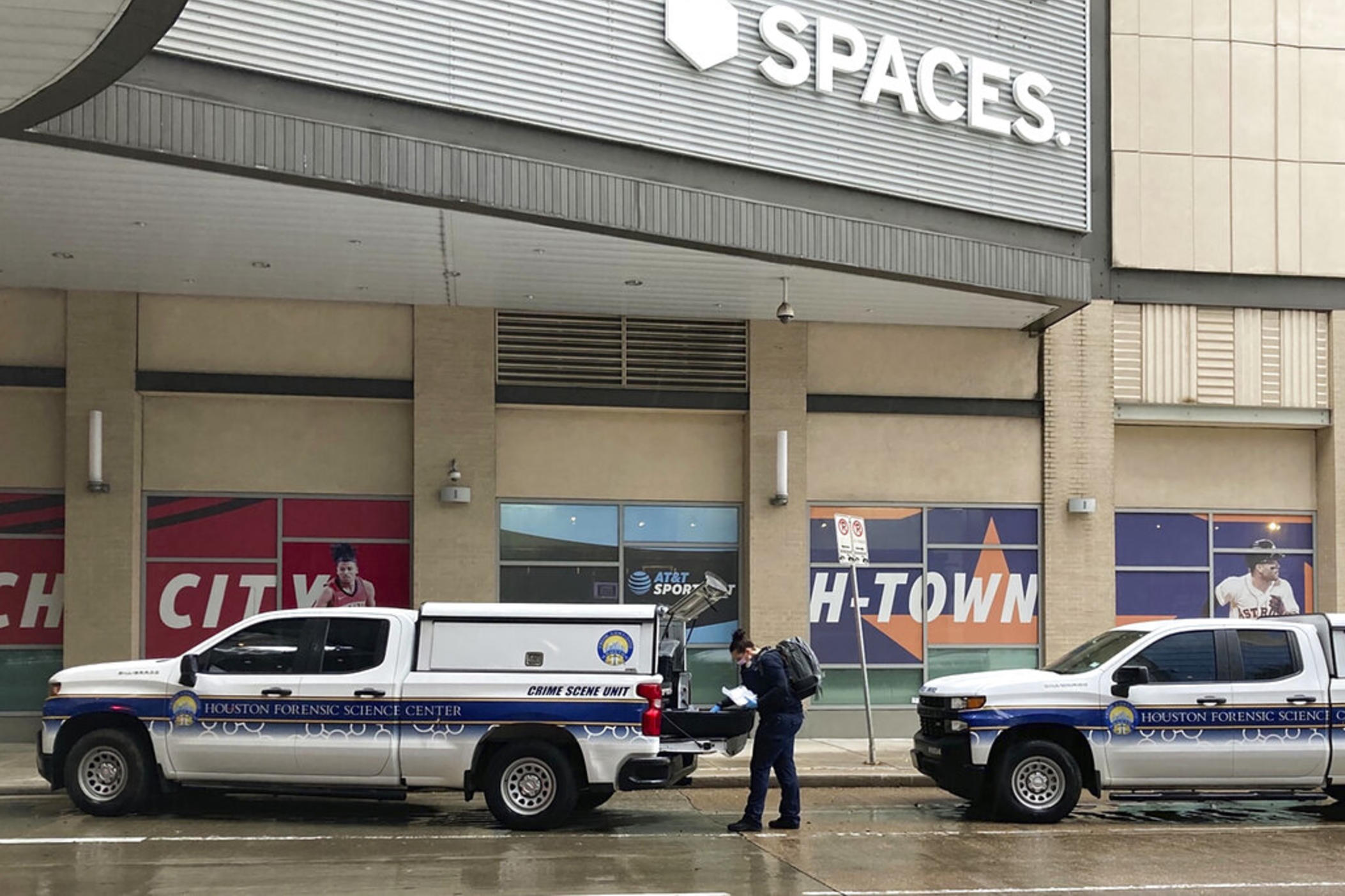 An officer with the Houston Police Department's Crime Scene Unit on Tuesday, Nov. 1, 2022 looks through equipment in the back of a truck while working the scene of a shooting in downtown Houston where Migos rapper Takeoff was fatally shot. A representative of the group has confirmed that Takeoff was killed during a shooting at the location. 