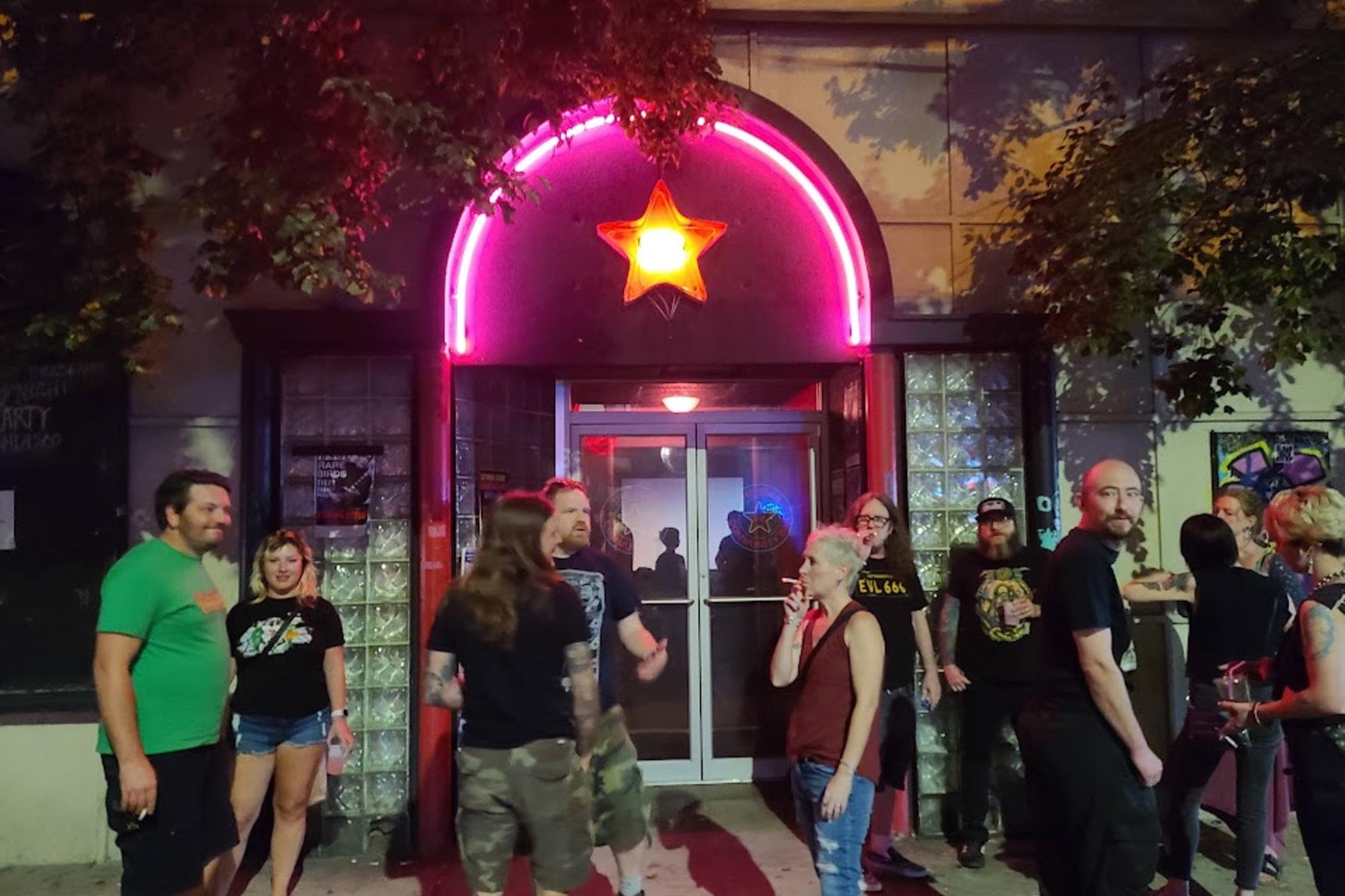 Patrons gathered outside of Star Community Bar following a community meeting September 18, 2022.