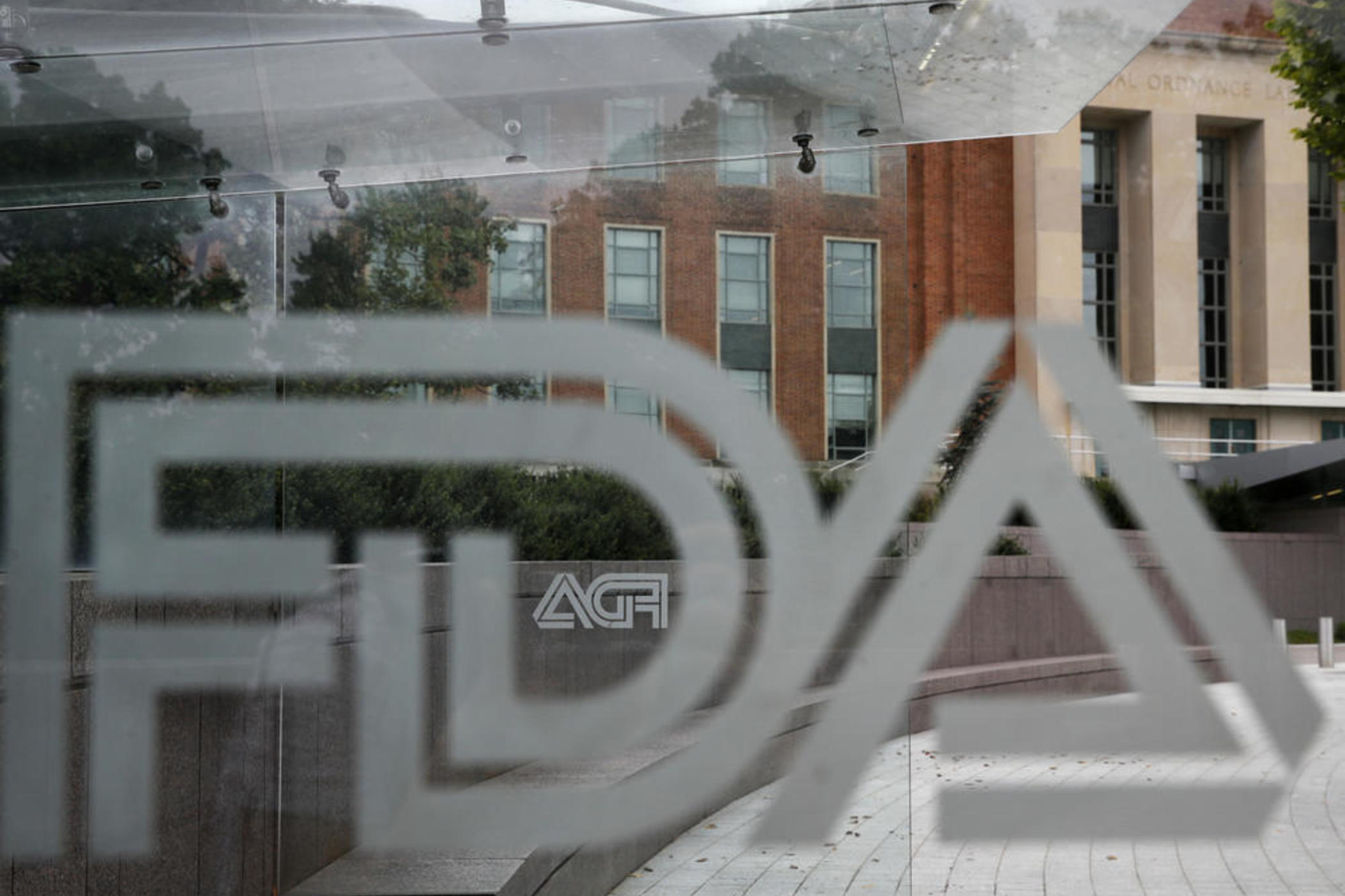 Food and Drug Administration (FDA) signage is seen through a bus stop at the U.S. Department of Health and Human Services, Thursday, Aug. 2, 2018, in Silver Spring, Md., on the FDA grounds.