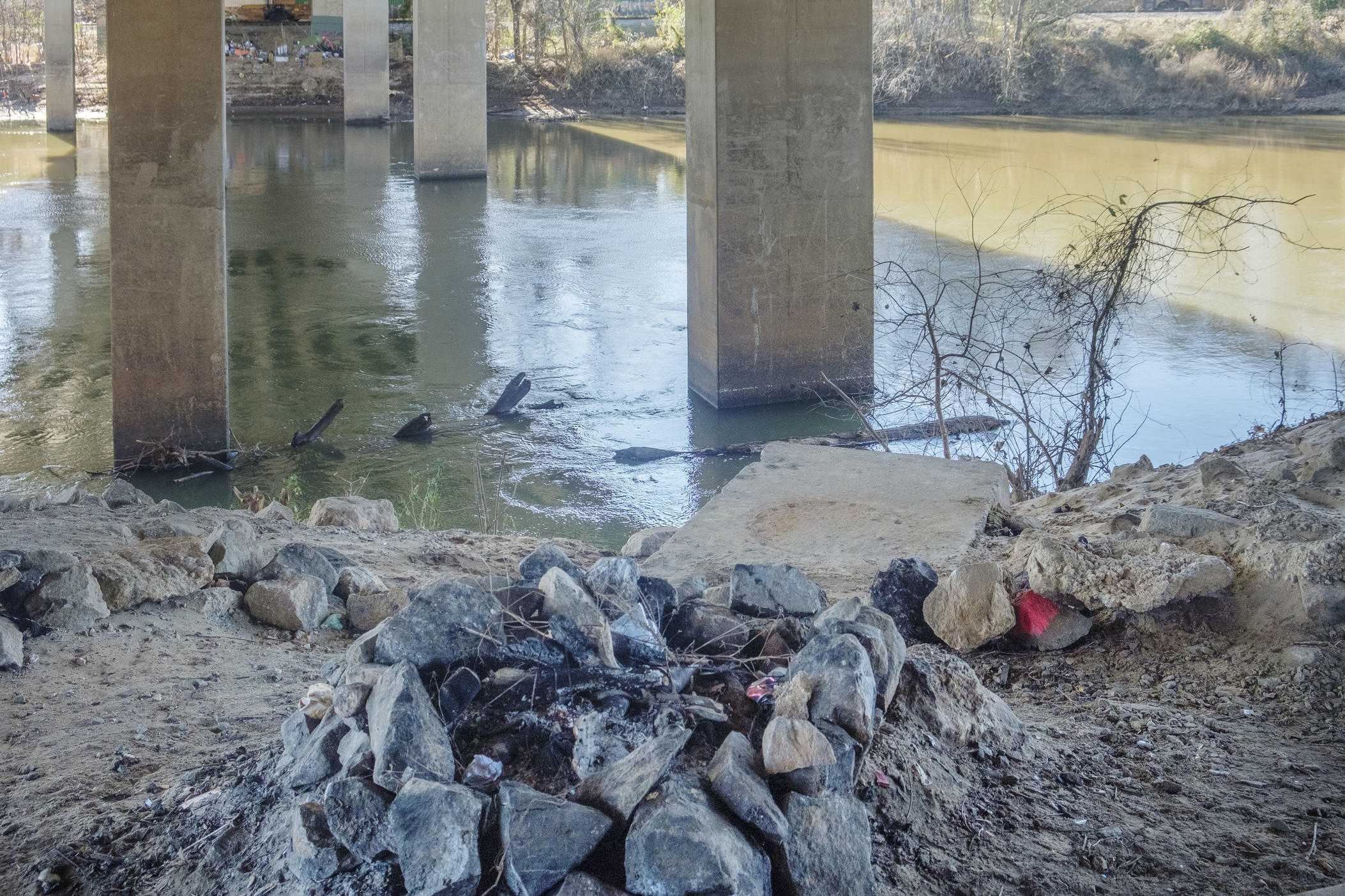 A cold fire circle underneath a Macon bridge on Wednesday, December 28. Bibb County Coroner Leon Jones said two men were killed in Macon by the recent record cold. 