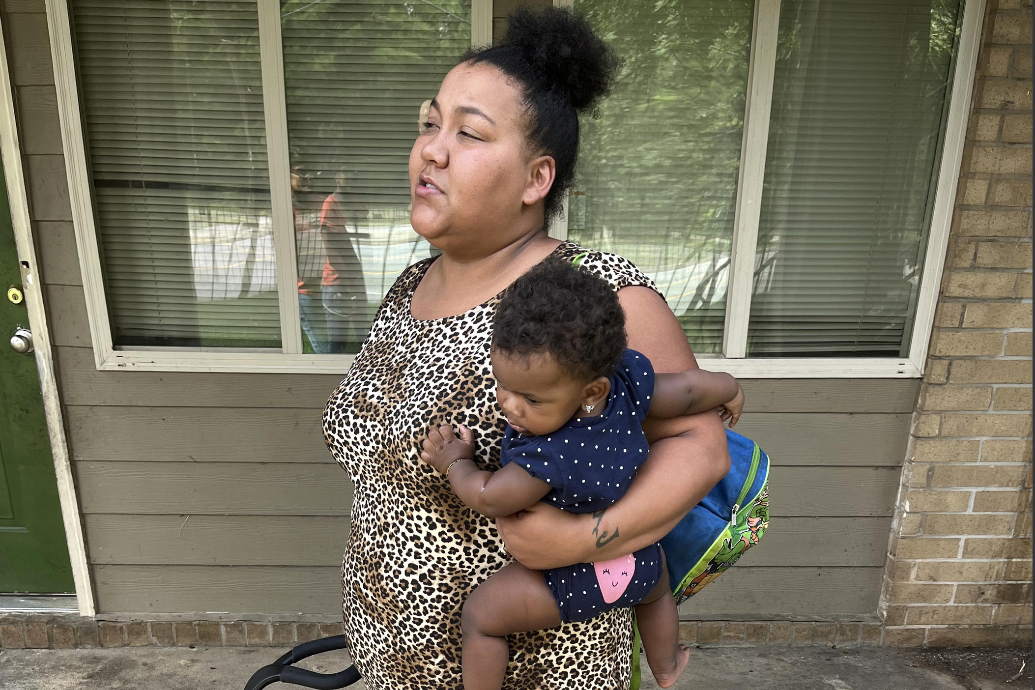 Louana Joseph and her daughter, Marlie, outside their former apartment complex in southwestern Atlanta. Joseph moved out of the unit because she suspects the gray and brown splotches that were spreading through the apartment were mold. After rents soared during the pandemic, some families were forced to live in substandard housing, which increased their risk for health problems such a s asthma and lead poisoning.