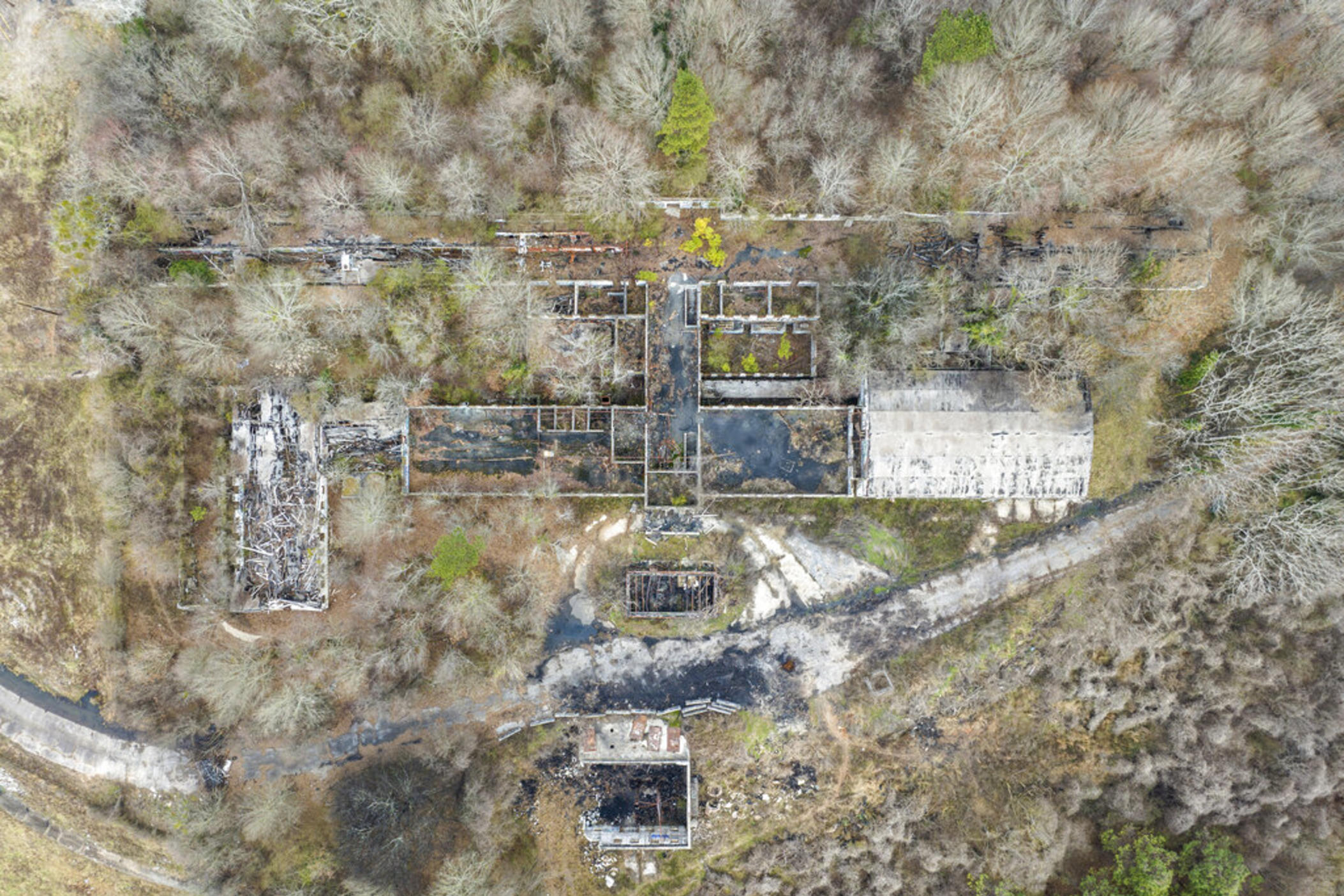 In this aerial view, a structure sits on land owned by the city of Atlanta, Thursday, Jan. 26, 2023, in unincorporated DeKalb County. The Atlanta City Council has approved plans to lease the land to the Atlanta Police Foundation so it can build a state-of-the-art police and firefighter training center, a project that protesters derisively call “Cop City.” 