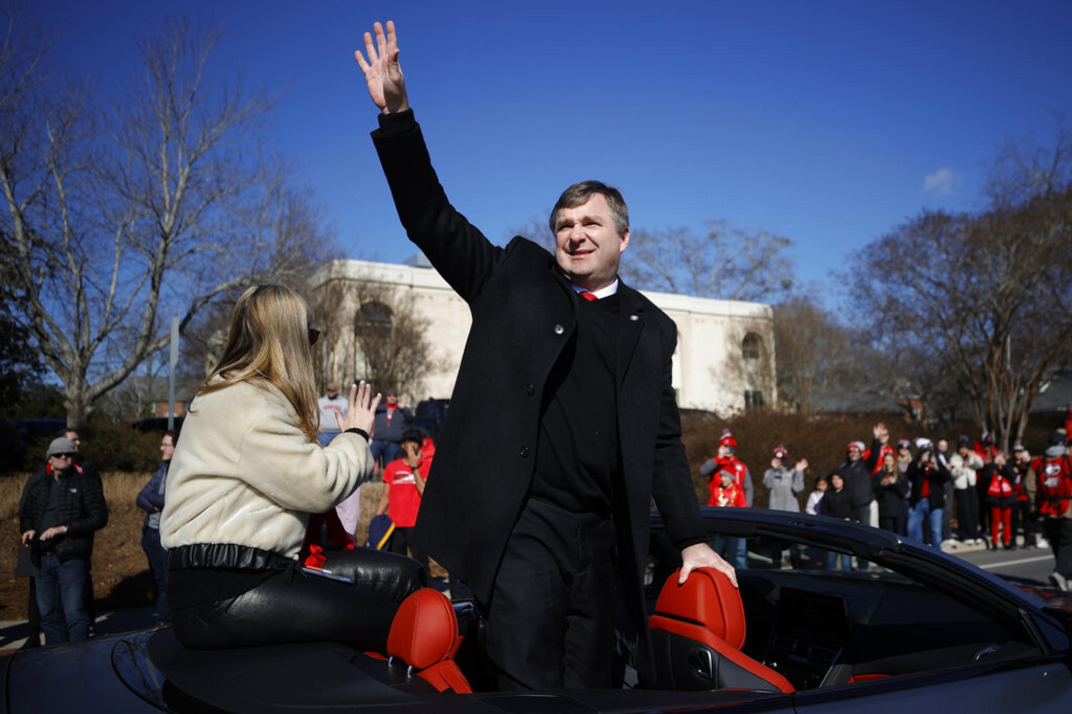 Georgia head coach Kirby Smart waves at fans during a parade celebrating the Bulldog's second consecutive NCAA college football national championship, Saturday, Jan. 14, 2023, in Athens, Ga.