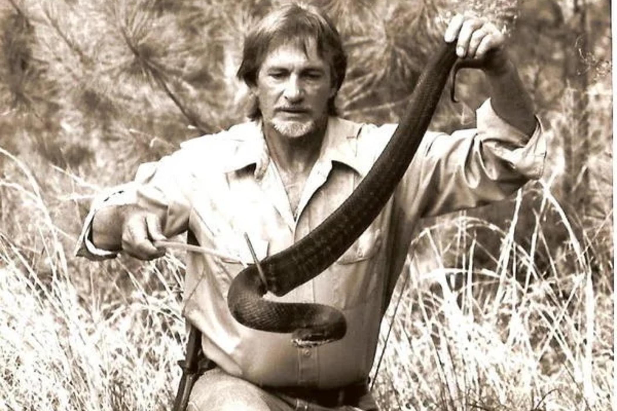 Man holding snake.