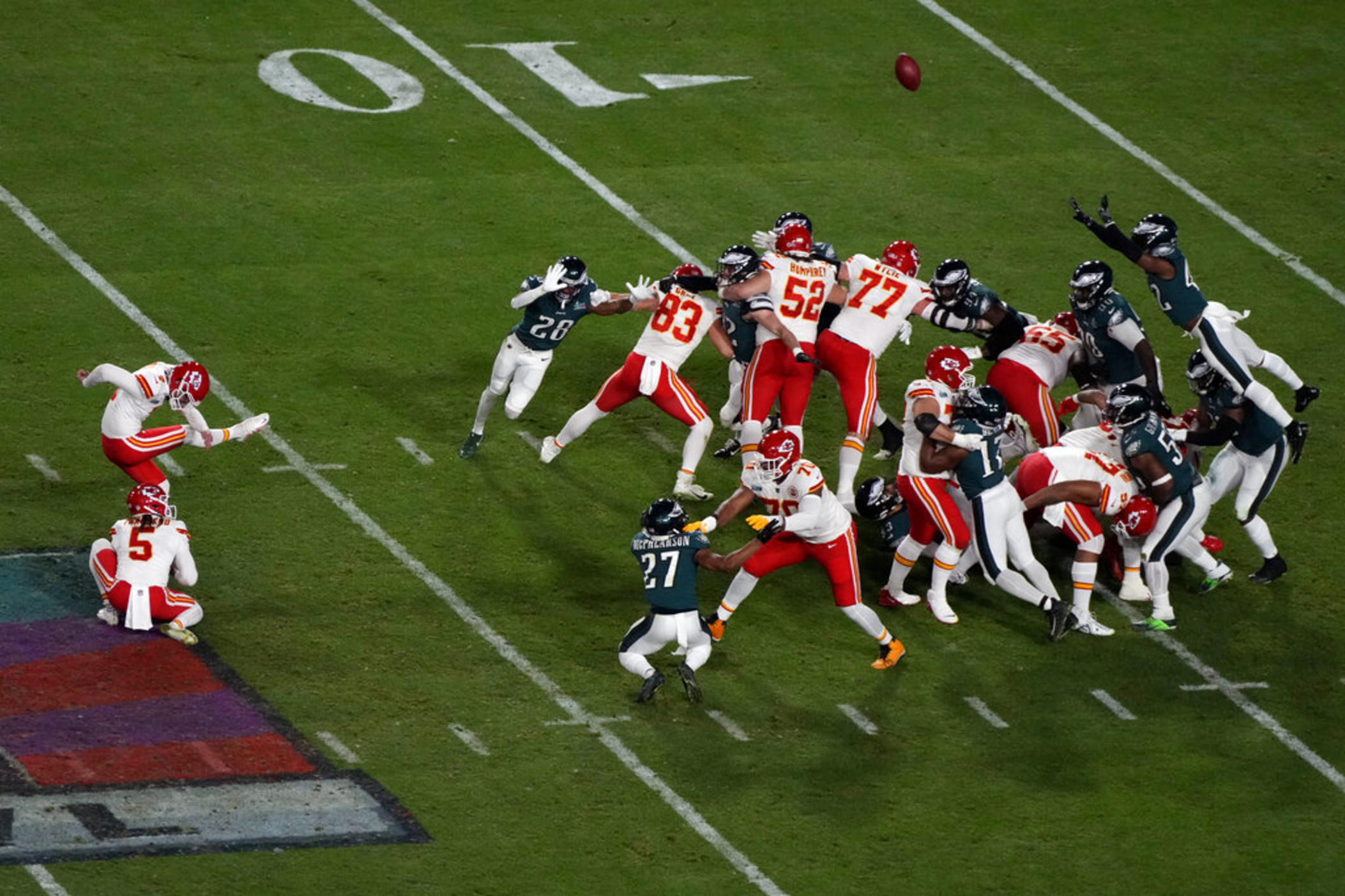 Kansas City Chiefs place kicker Harrison Butker (7) kicks the game-winning field goal as punter Tommy Townsend (5) holds during the second half of the NFL Super Bowl 57 football game against the Philadelphia Eagles, Sunday, Feb. 12, 2023, in Glendale, Ariz.
