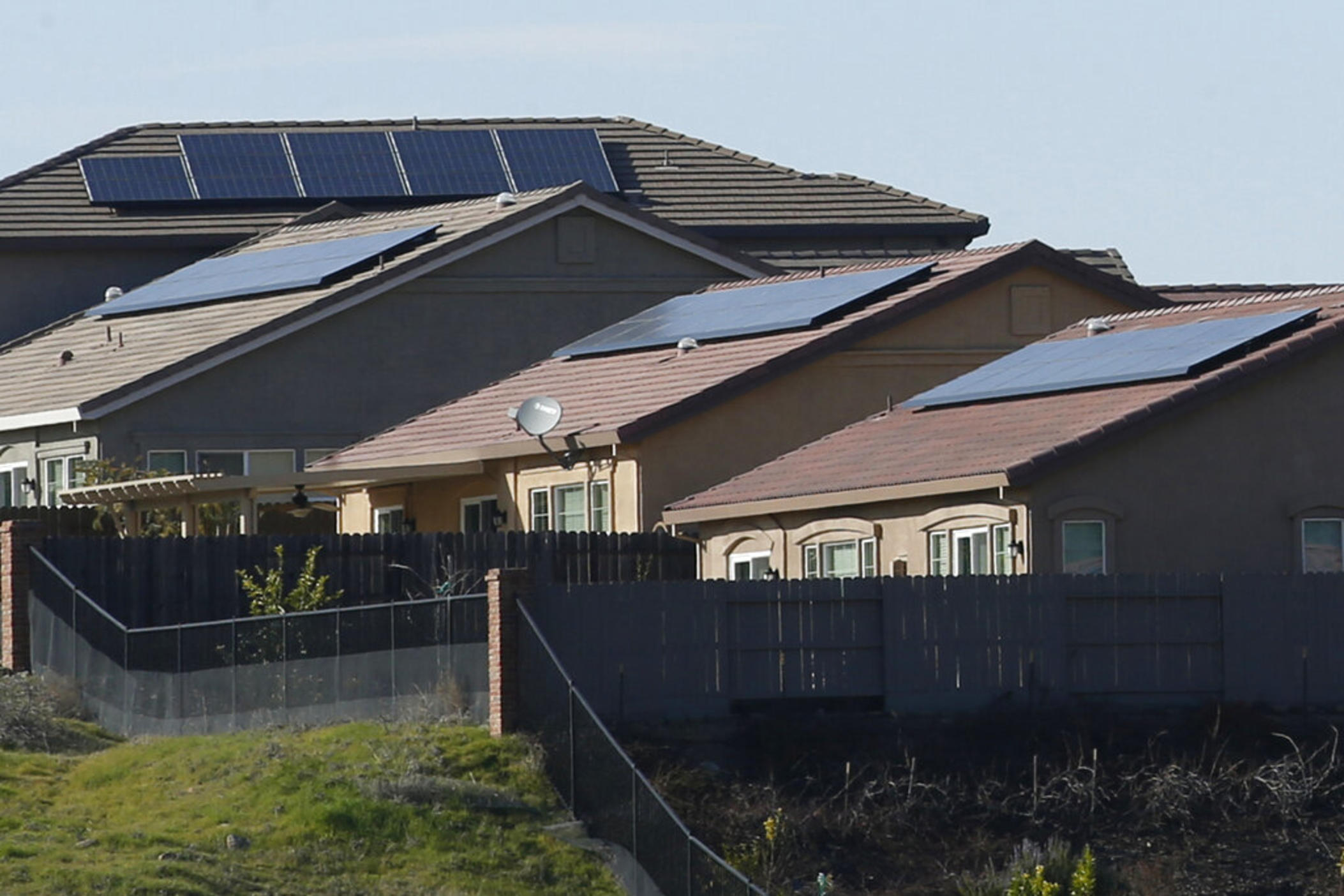 Solar panels on rooftops of a housing development in Folsom, Calif., Feb. 12, 2020.