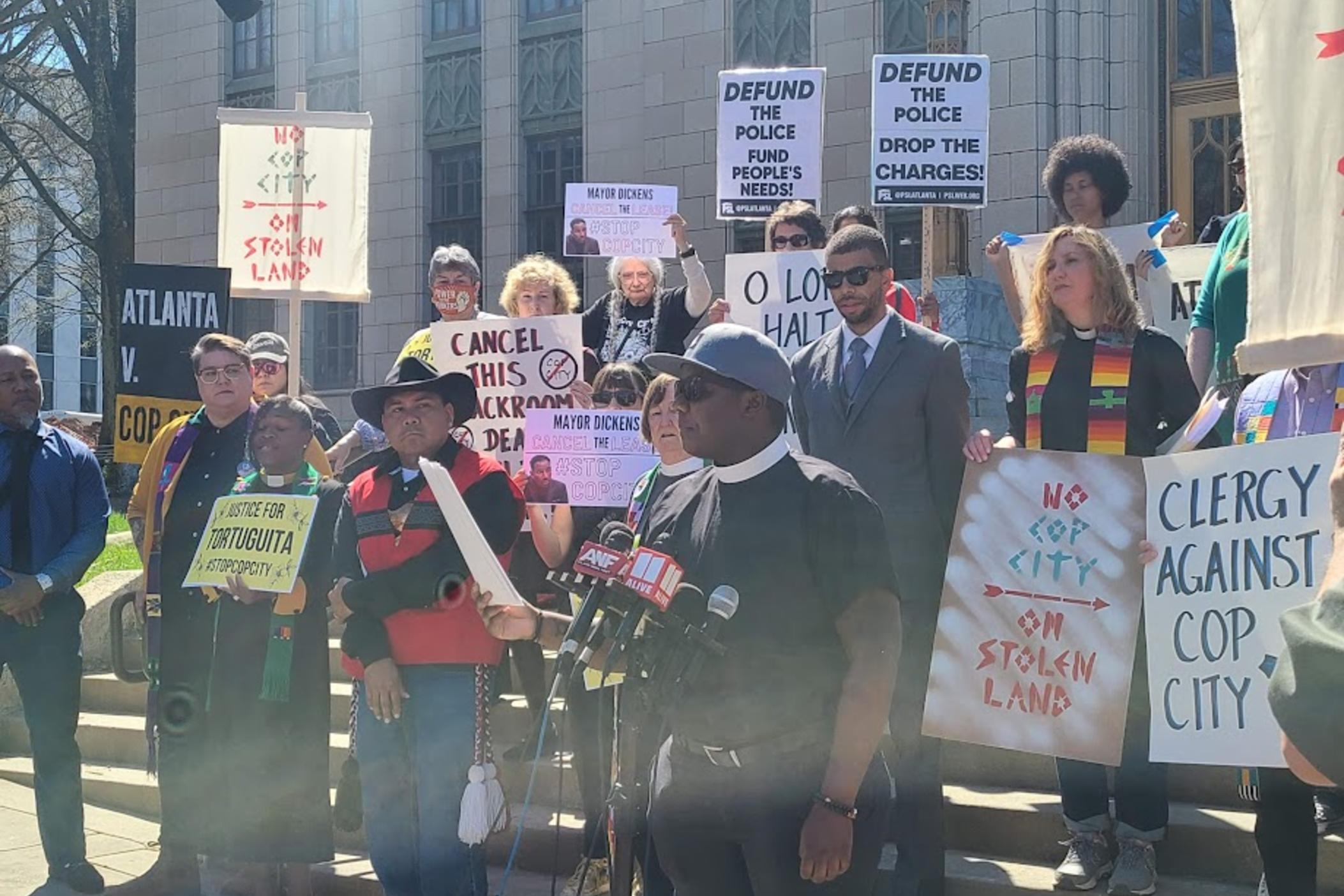 Reverend Leo Seyij Allen speaks at a rally of clergy demanding the Atlanta City Council stop construction on the public safety training center and drop charges against protesters.