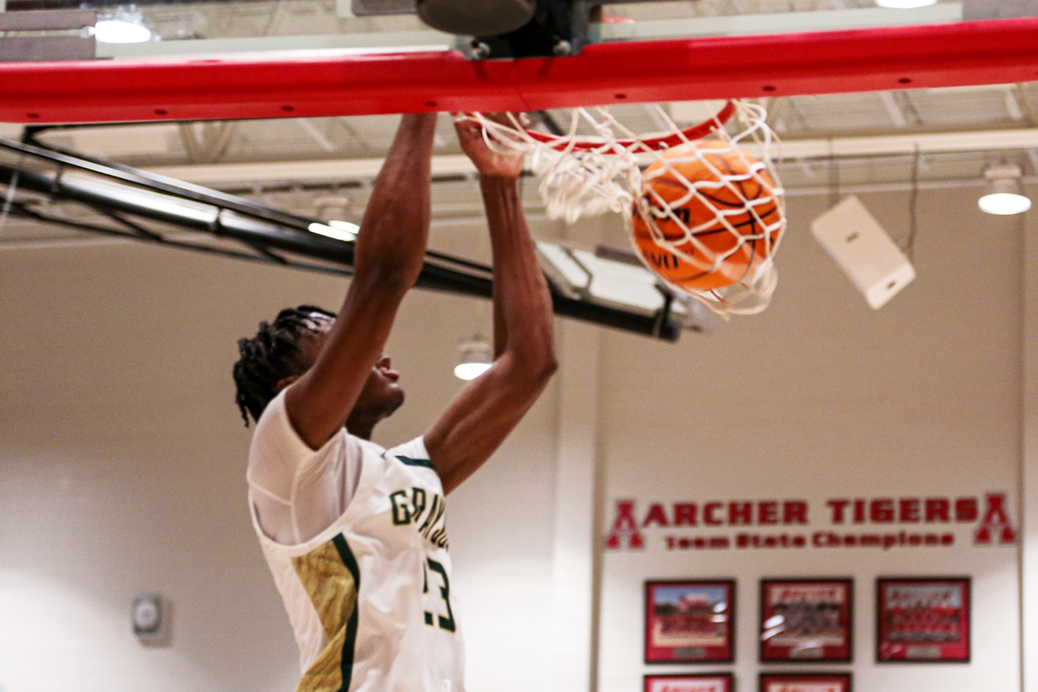Chad Moodie, senior #23, landed a dunk in Grayson's 76-53 win over Valdosta in the 2nd round of the GHSA Basketball Playoffs.