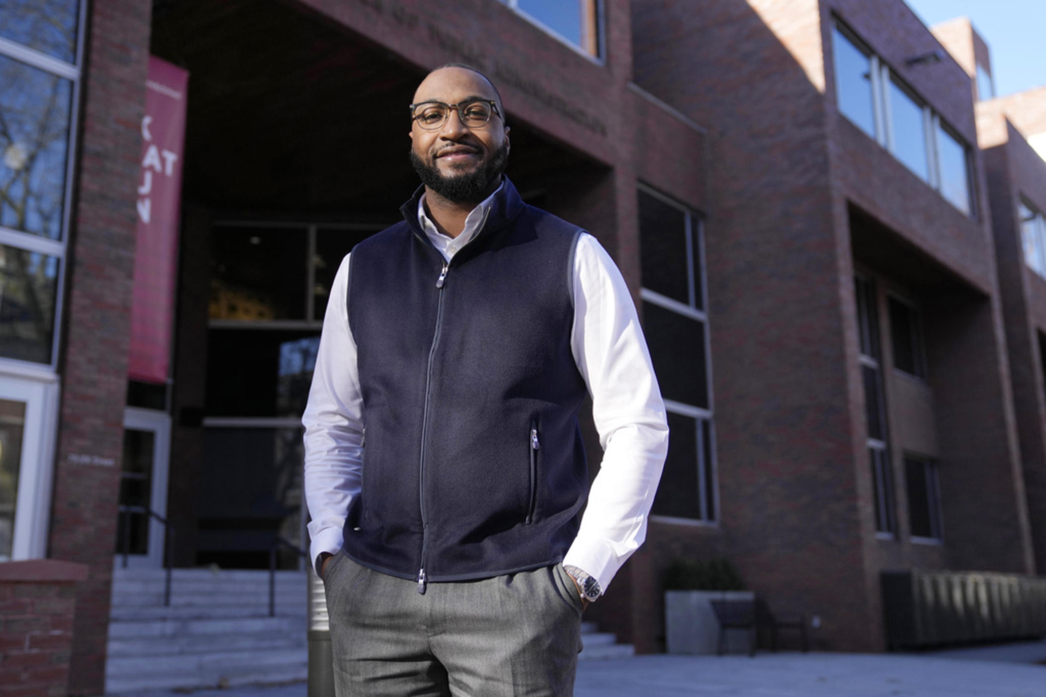 Quentin Fulks, who managed Sen. Raphael Warnock's re-election campaign in 2022, stands for a portrait outside the John F. Kennedy School of Government at Harvard University, Thursday, Feb. 2, 2023, in Cambridge, Mass. Growing up Black in a majority white county where Donald Trump won 79% of the vote helped Fulks understand what Democrats had to do to win in a historically conservative state.