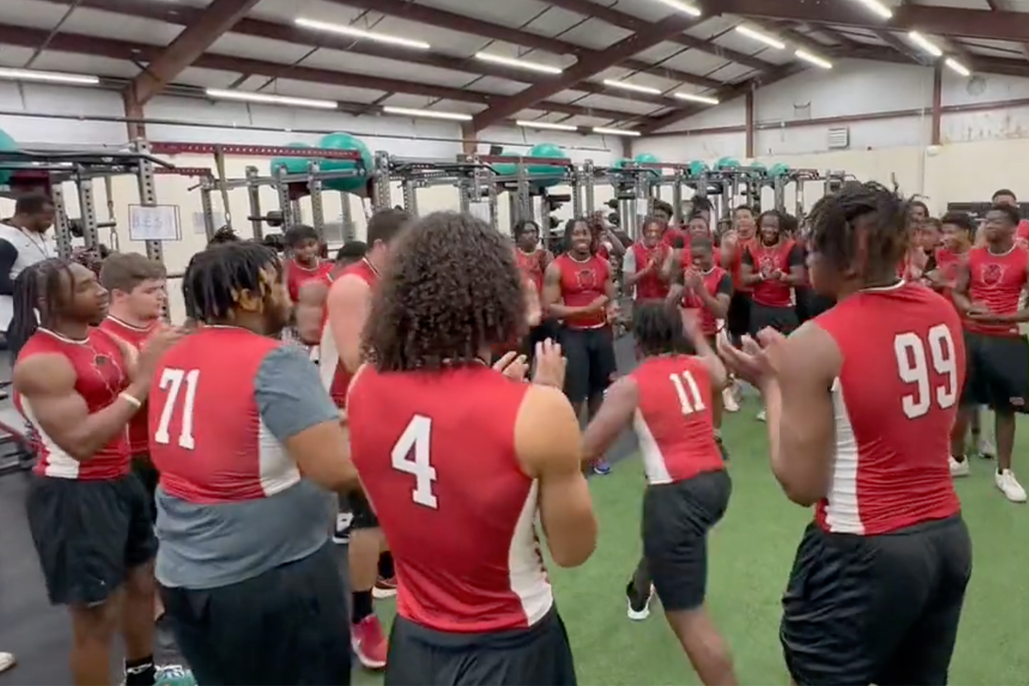 The Warner Robins football team brings the energy in warmups for new head coach Shane Sams.