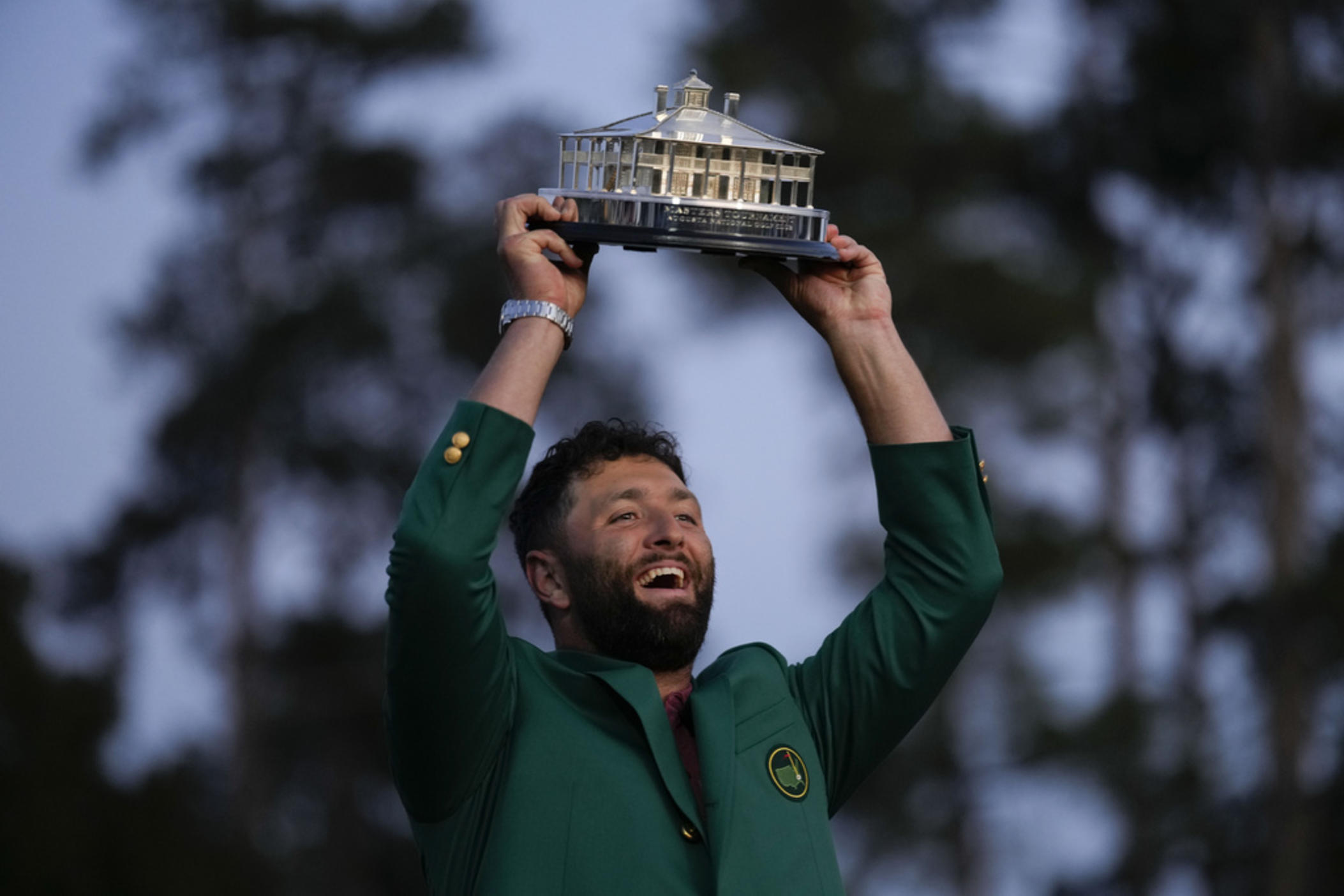 Jon Rahm, of Spain, celebrates holding the Masters trophy winning the Masters golf tournament at Augusta National Golf Club on Sunday, April 9, 2023, in Augusta, Ga.