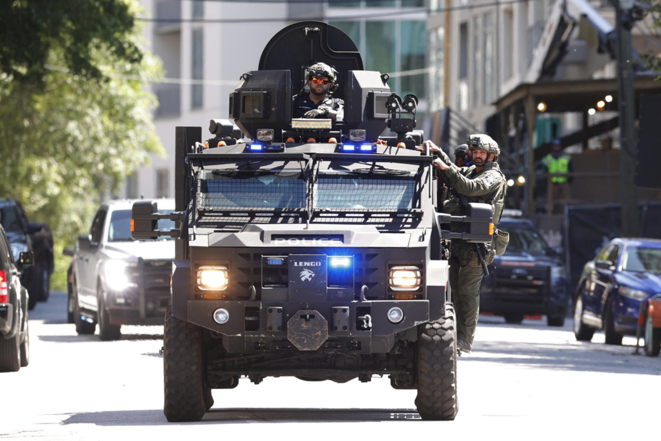 Law enforcement officers arrive near the scene of an active shooter on Wednesday, May 3, 2023 in Atlanta. Atlanta police said there had been no additional shots fired since the initial shooting unfolded inside a building in a commercial area with many office towers and high-rise apartments.