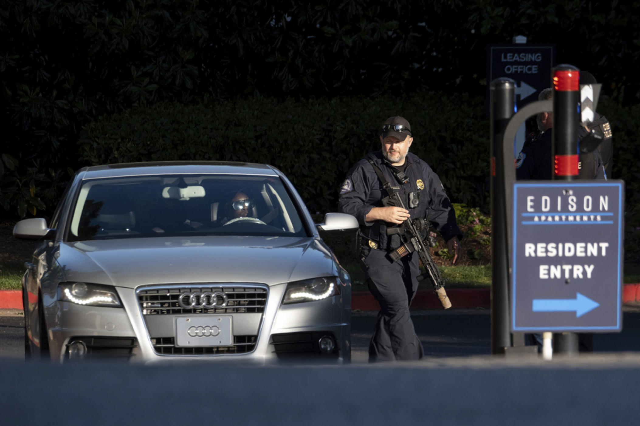 Cobb County Police search cars as they leave the Edison Apartments in Smyrna, Ga., Wednesday, May 3, 2023, after a shooter killed one person and injured four others in a medical building in Atlanta, then was seen on a traffic camera in the area.