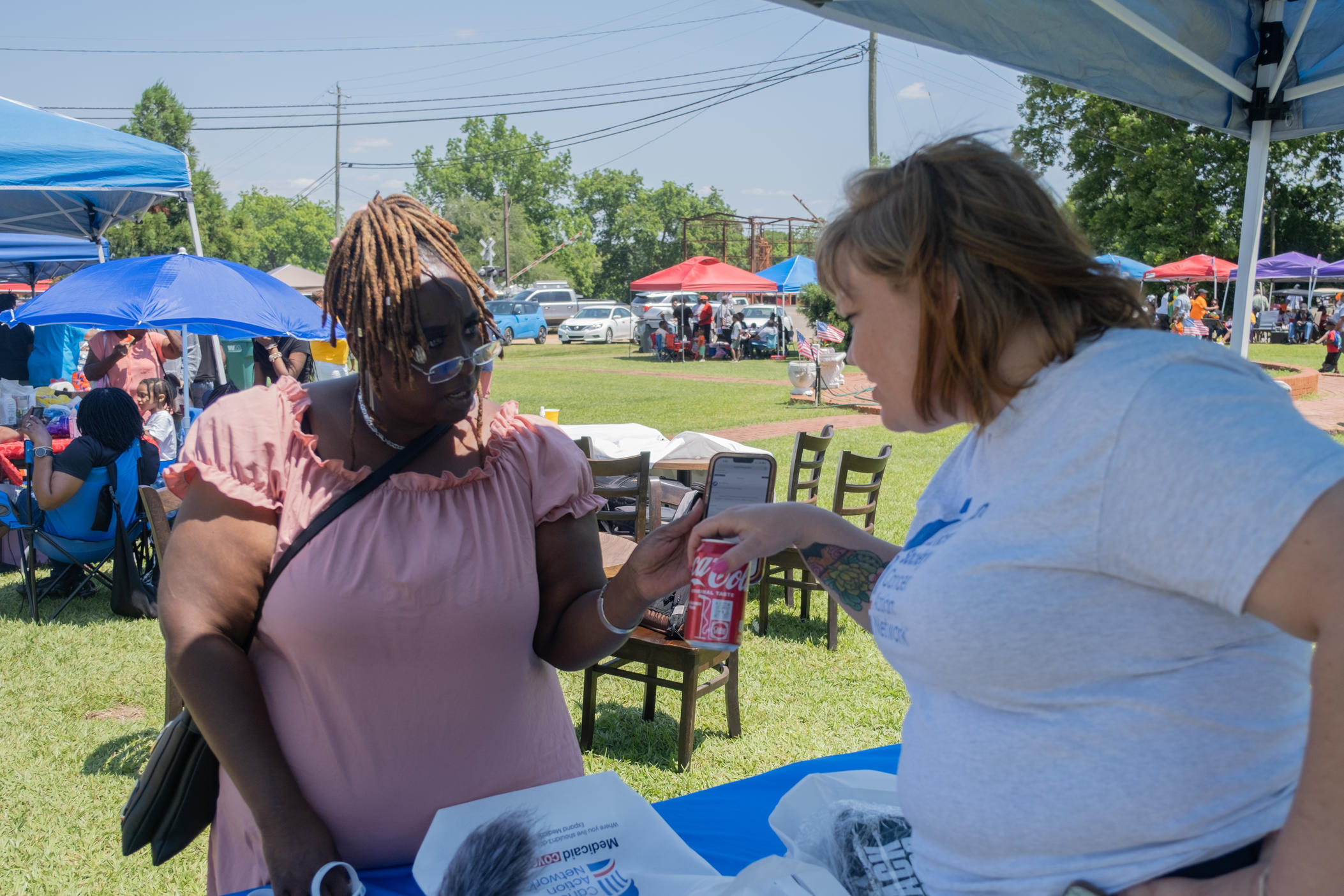 Byromville resident Melister Wiggins shows Kristen Kiefer her Medicaid renewal notification posted on Georgia Gateway. People who aren't automatically renewed  have 45 days from the date of their scheduled renewal date to submit missing information about their eligibility to the state in order to keep their benefits.