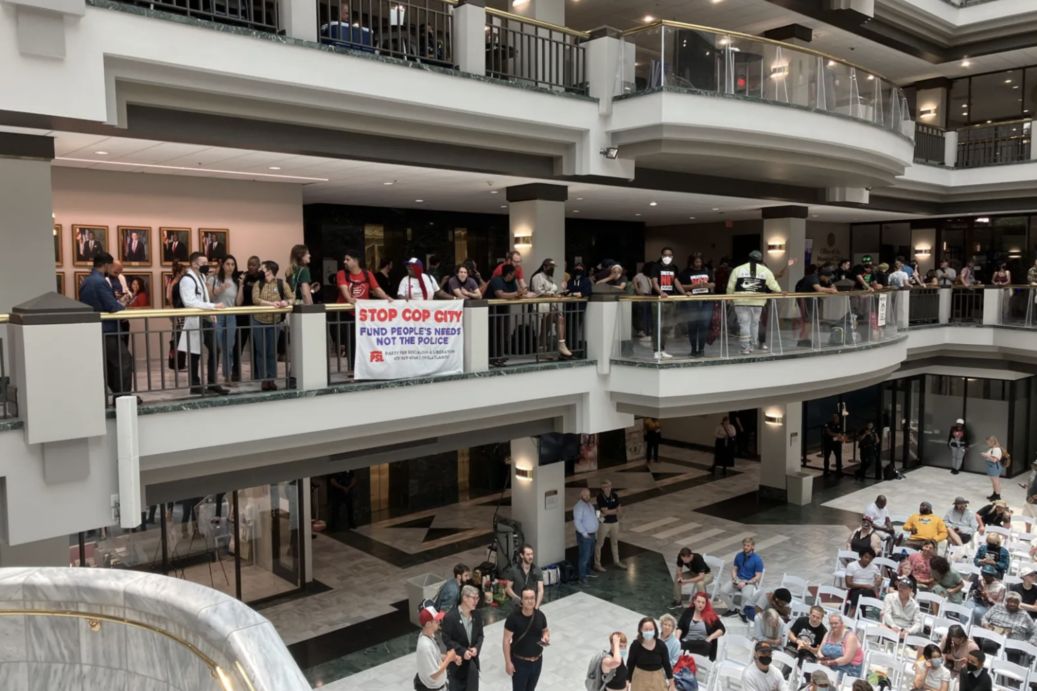Hundreds rallied in the atrium of Atlanta City Hall on Monday to show and voice their opposition to the planned public safety training center. The City Council voted early Tuesday morning on funding the center. 