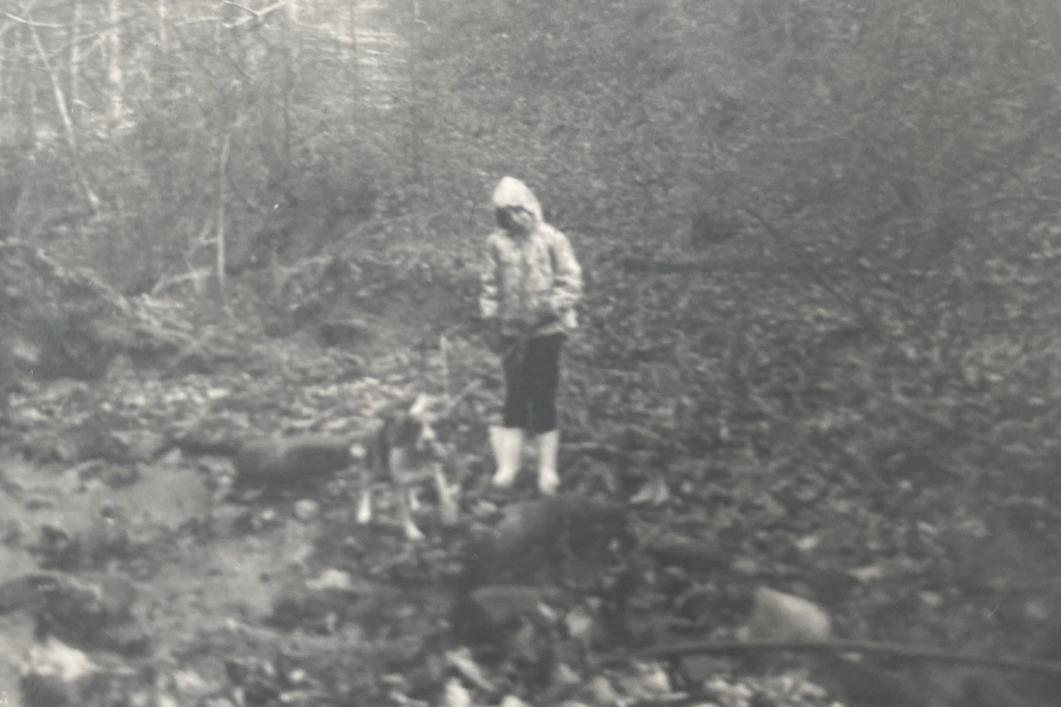 Sharon Collins, 9, with her beagle Droopy - "in a creek I wasn't supposed to be in."