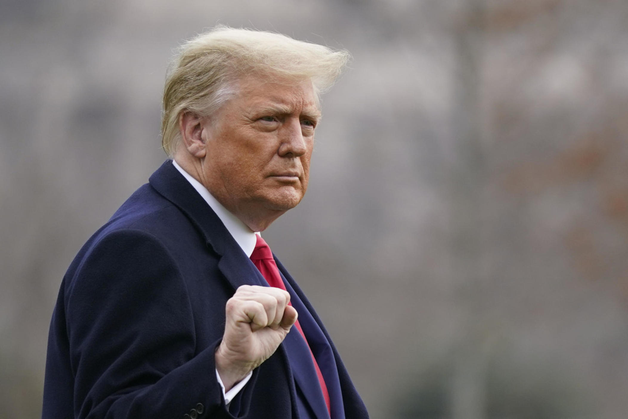 President Donald Trump walks on the South Lawn of the White House in Washington, Saturday, Dec. 12, 2020, before boarding Marine One.