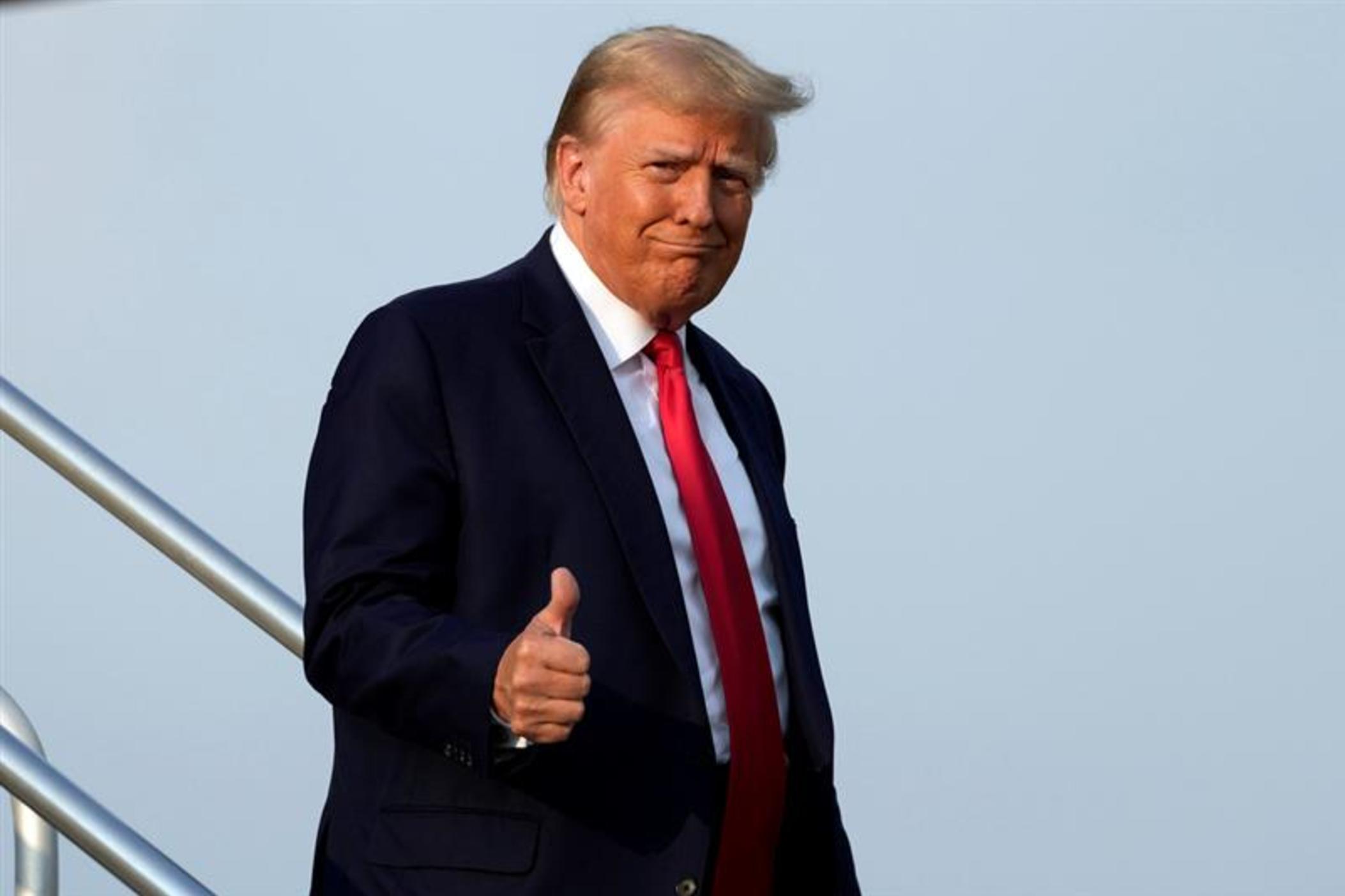 Former President Donald Trump steps off his plane as he arrives at Hartsfield-Jackson Atlanta International Airport, Thursday, Aug. 24, 2023, in Atlanta. Trump is headed to the Fulton County Jail. 