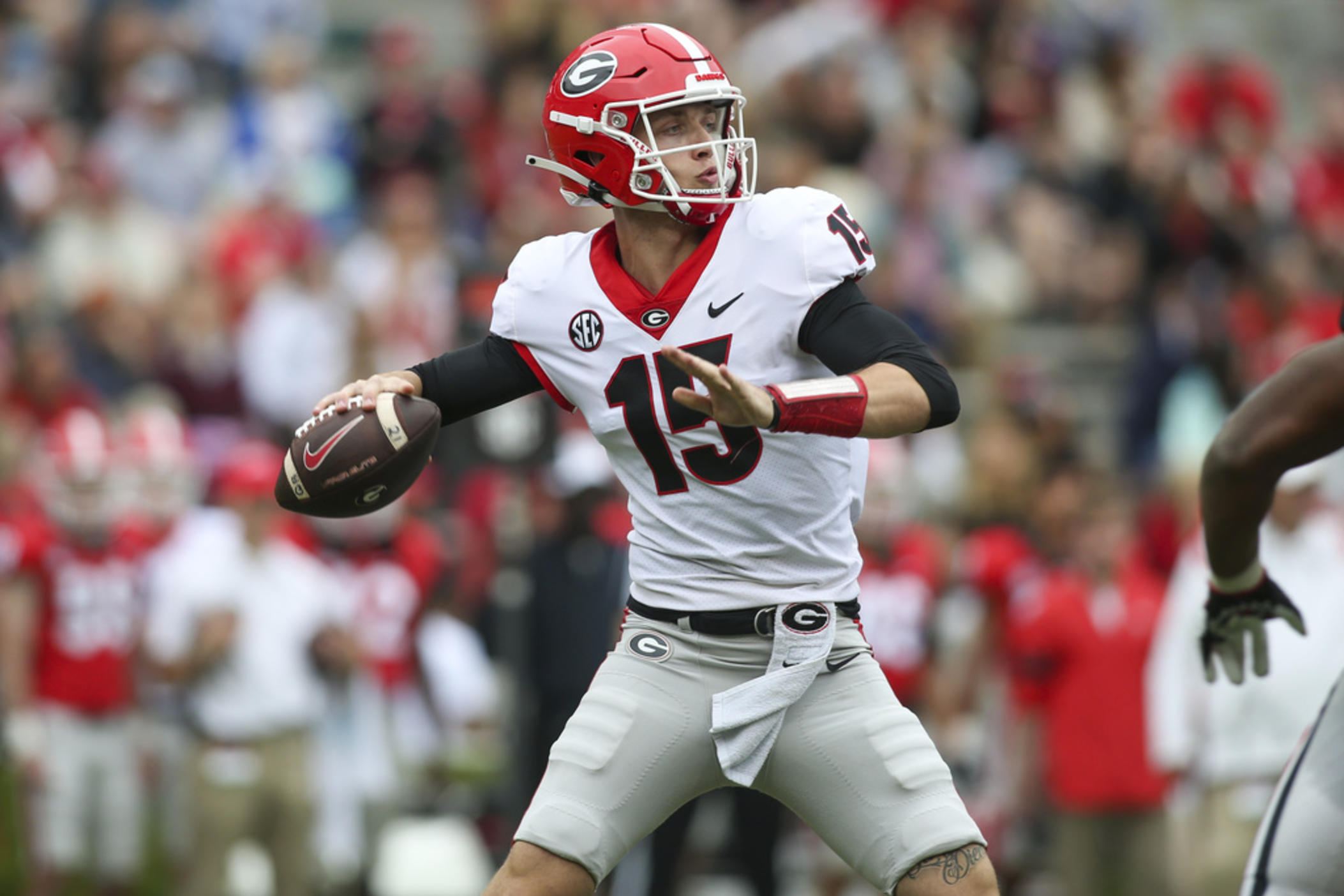 Georgia quarterback Carson Beck (15) throws in the first half of Georgia's spring NCAA college football game, Saturday, April 16, 2022, in Athens, Ga. Coach Kirby Smart has made it clear that Carson Beck is the quarterback to beat.