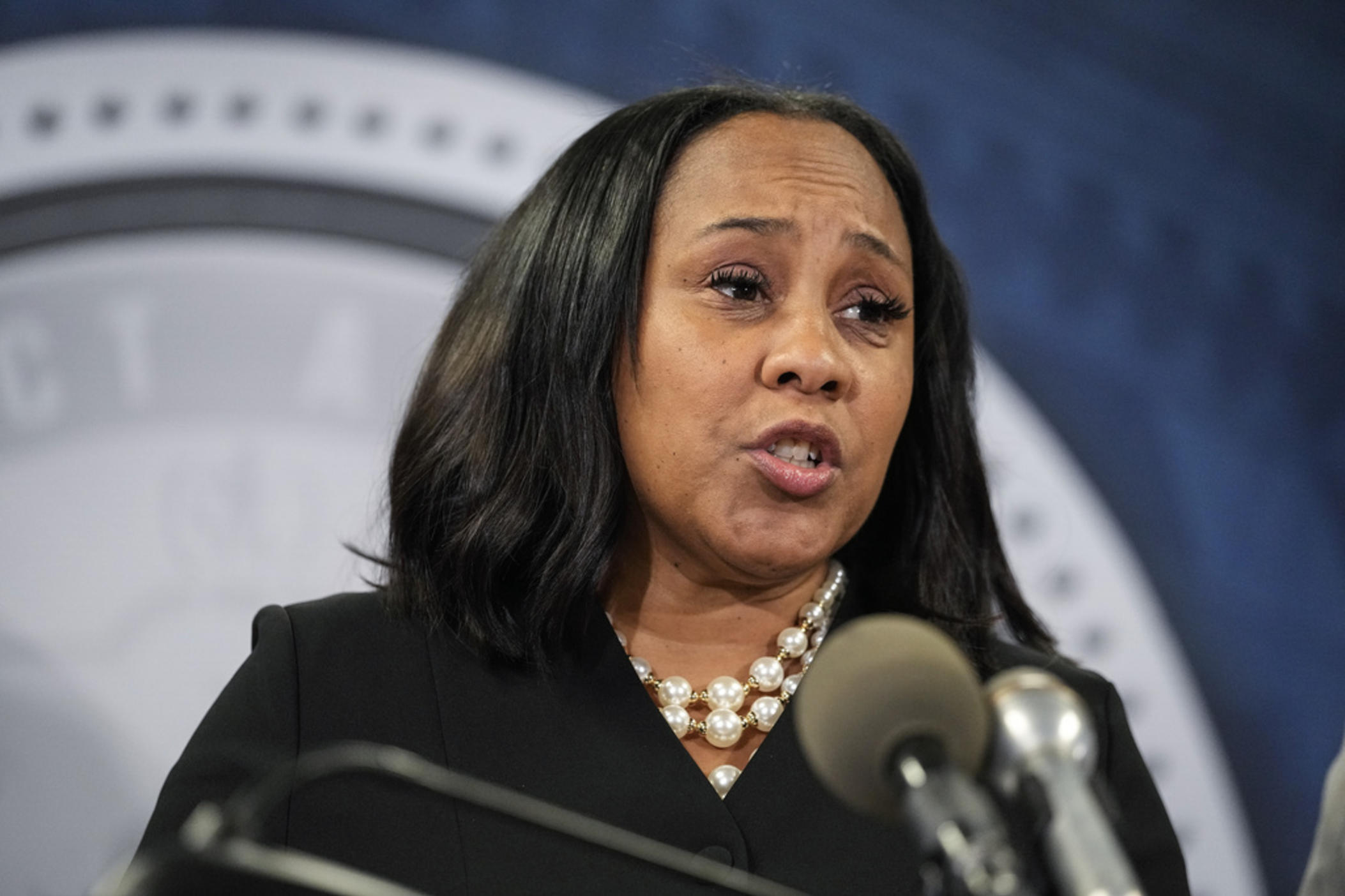 Fulton County District Attorney Fani Willis speaks in the Fulton County Government Center during a news conference, Monday, Aug. 14, 2023, in Atlanta. Donald Trump and several allies have been indicted in Georgia over efforts to overturn his 2020 election loss in the state. 