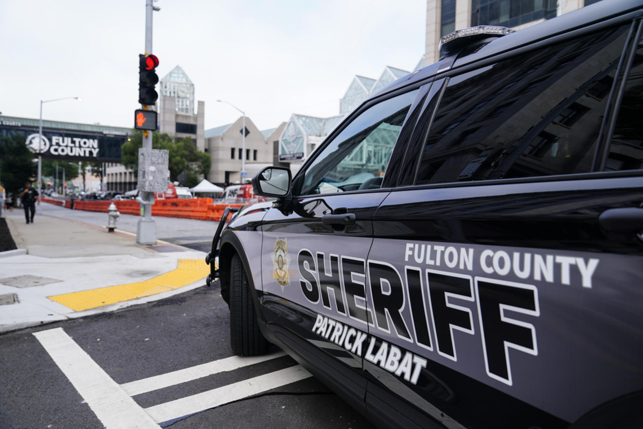 Barricades are seen near the Fulton County courthouse, Monday, Aug. 7, 2023, in Atlanta. The sheriff's office are implementing various security measures ahead of District Attorney Fani Willis possibly seeking an indictment in her investigation into whether former President Donald Trump and his allies illegally meddled in the 2020 election in Georgia. 