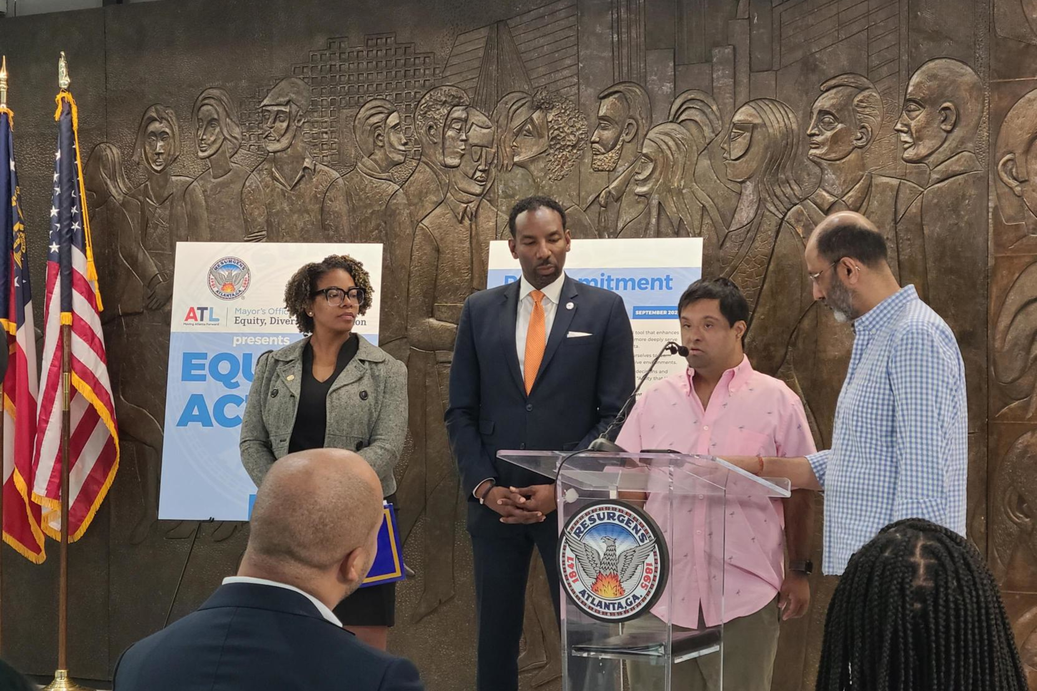 Entrepreneur and Georgia State University student Angad Saghal (second from right) speaks at a press conference about inclusivity as his father, Amit Saghal (right), Mayor Andre Dickens (second from left) and Atlanta Chief Equity Officer Candace Stanciel (left) watch Sept. 7, 2023.