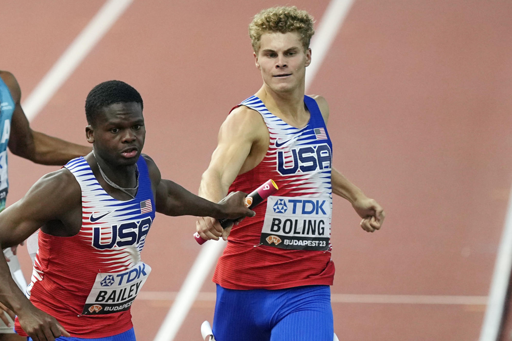 Matthew Boling hands off to Christopher Bailey in a men's 4 X 100-meters relay heat during the World Athletics Championships in Budapest, Hungary, Saturday, Aug. 26, 2023. Boling is making big changes this offseason. He’s leaving Georgia to turn pro with a focus on making the U.S. team for the Paris Olympics.