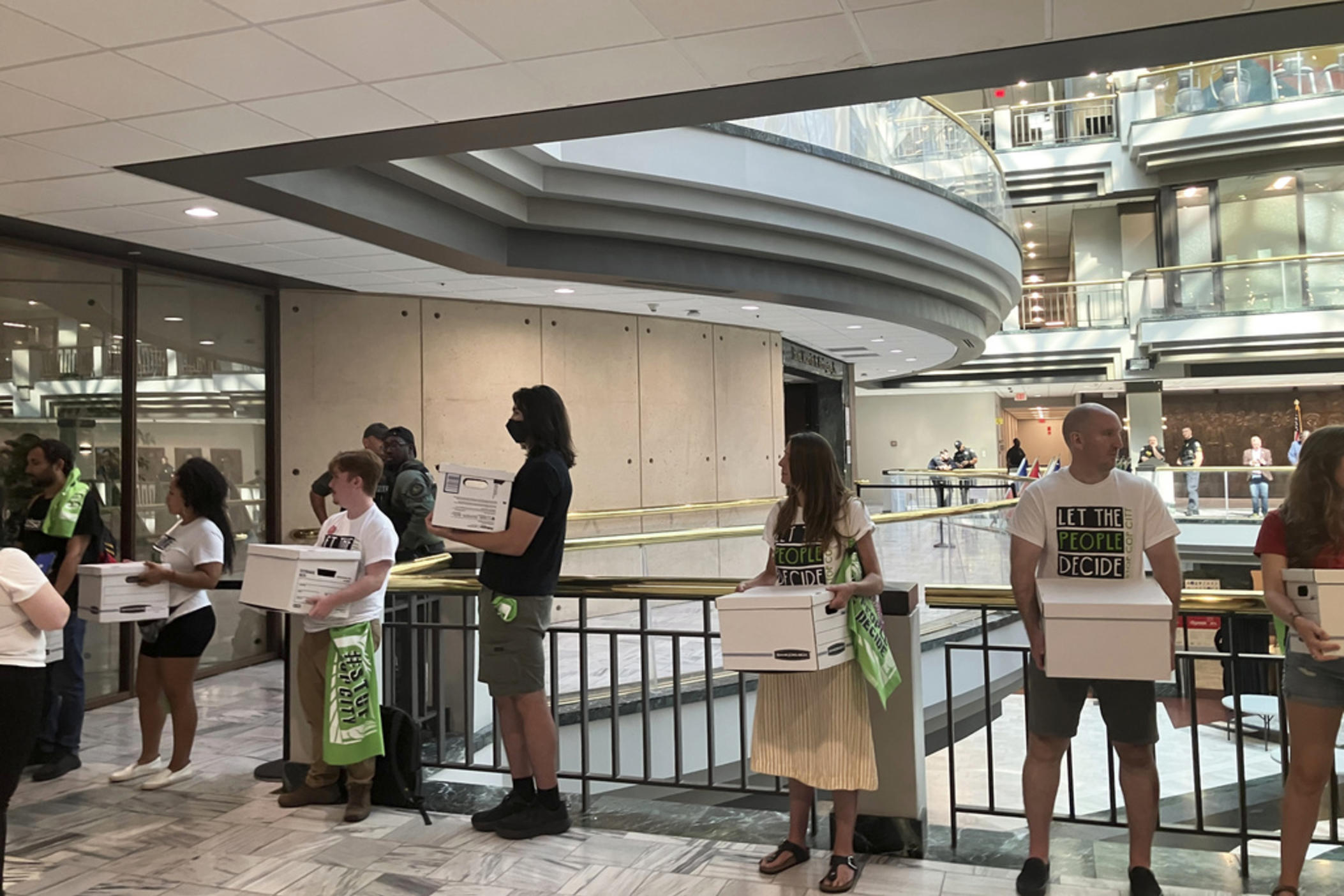 Activists haul dozens of boxes full of signed petitions to Atlanta City Hall, Monday, Sept. 11, 2023, to force a referendum on the future of a planned police and firefighter training center. Shortly after, though, Atlanta officials refused to accept the paperwork for processing, saying the city is awaiting a court decision over whether the petitions had been turned in on time. 