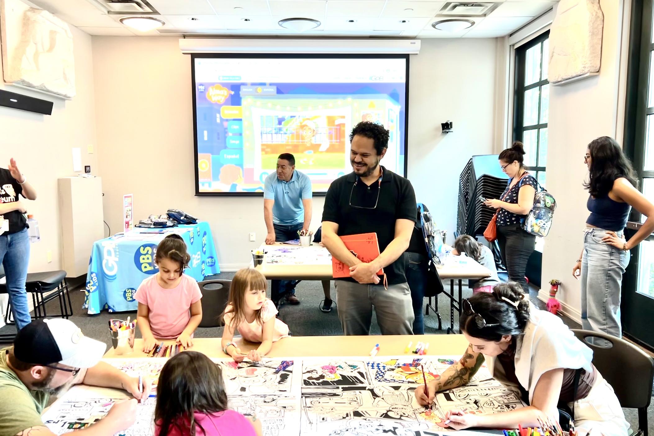 Children coloring with author 