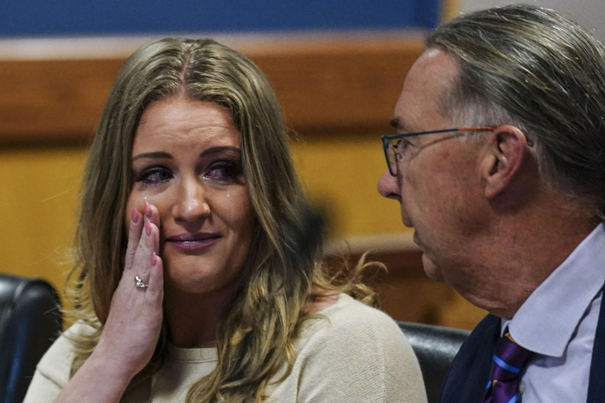 Jenna Ellis speaks with her attorney Franklin Hogue after Ellis plead guilty to a felony count of aiding and abetting false statements and writings, inside Fulton Superior Court Judge Scott McAfee's Fulton County Courtroom, Tuesday, Oct. 24, 2023, in Atlanta. Ellis, an attorney and prominent conservative media figure, reached a deal with prosecutors Tuesday, Oct. 24, 2023, and pleaded guilty to a reduced charge over efforts to overturn Donald Trump's 2020 election loss in Georgia.