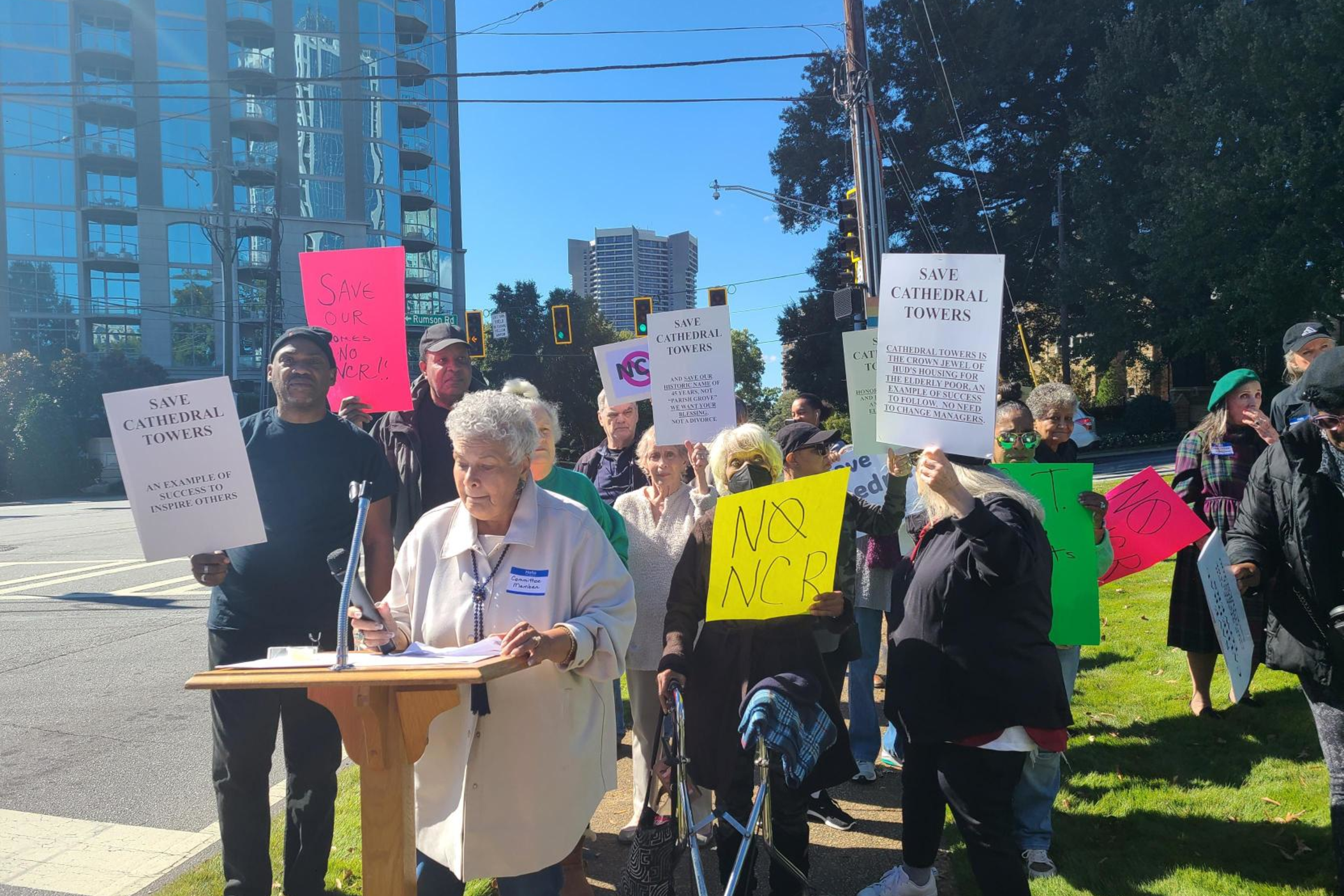 St.Phillips Cathedral Towers resident and vice chairman of its residents' association Denise Smith speaks at a rally outside the church protesting potential new property management.