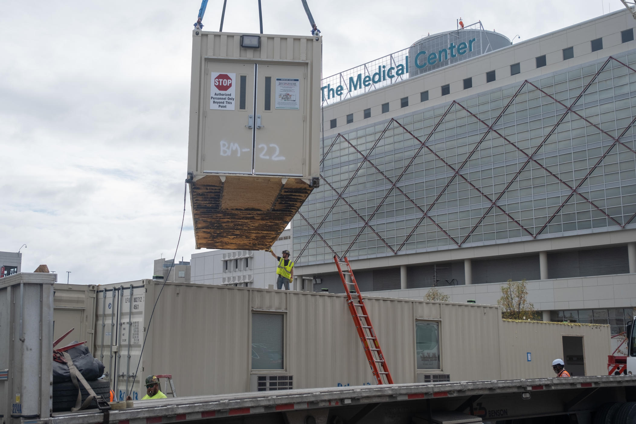 A shipping container, part of The Medical Center's temporary medical unit, gets prepared for transport to Atlanta.