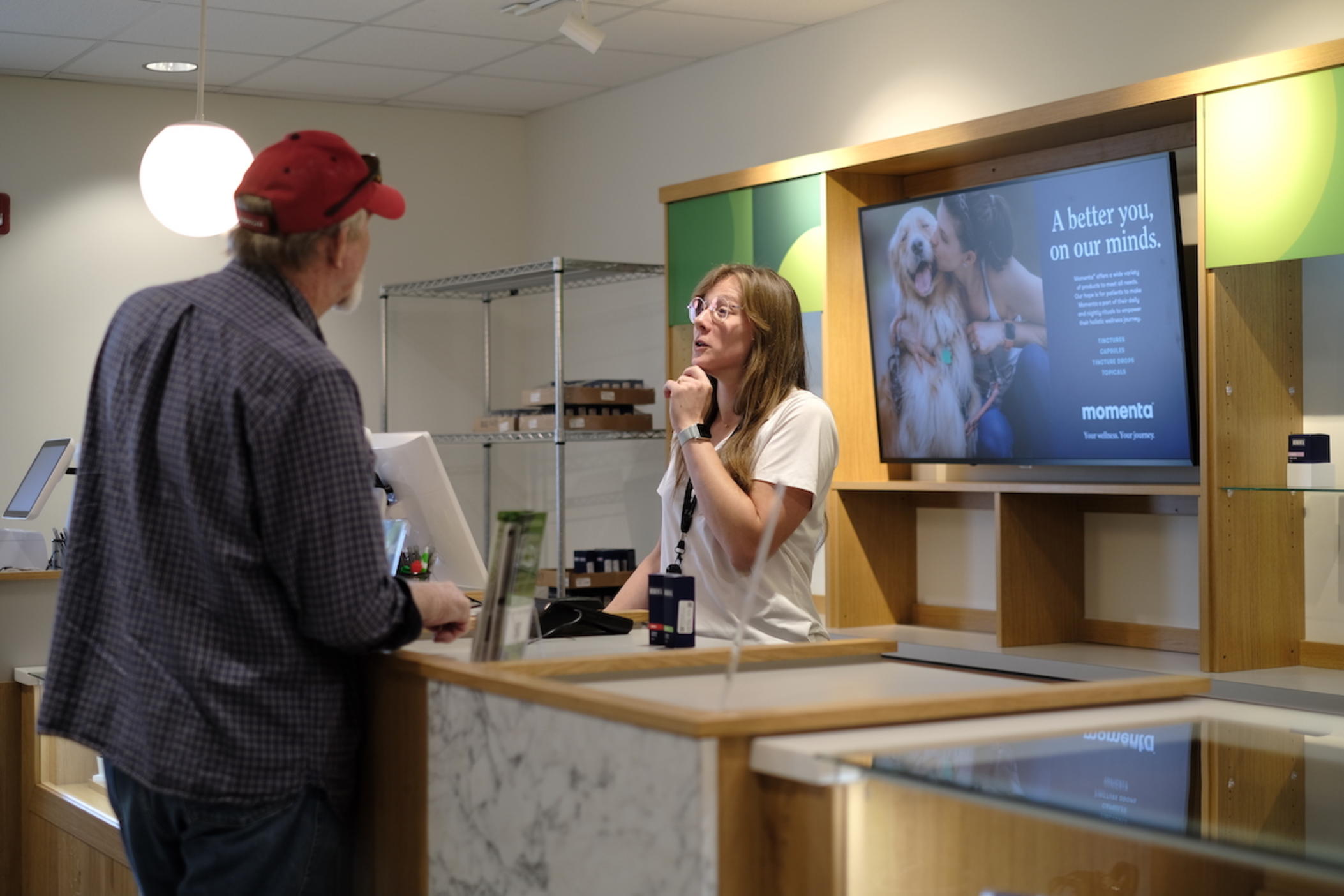 Dispensary Associate and Patient Educator Michelle Dubiel sells low THC oil products to a registered patient at Trulieve Dispensary in Macon, Ga. 