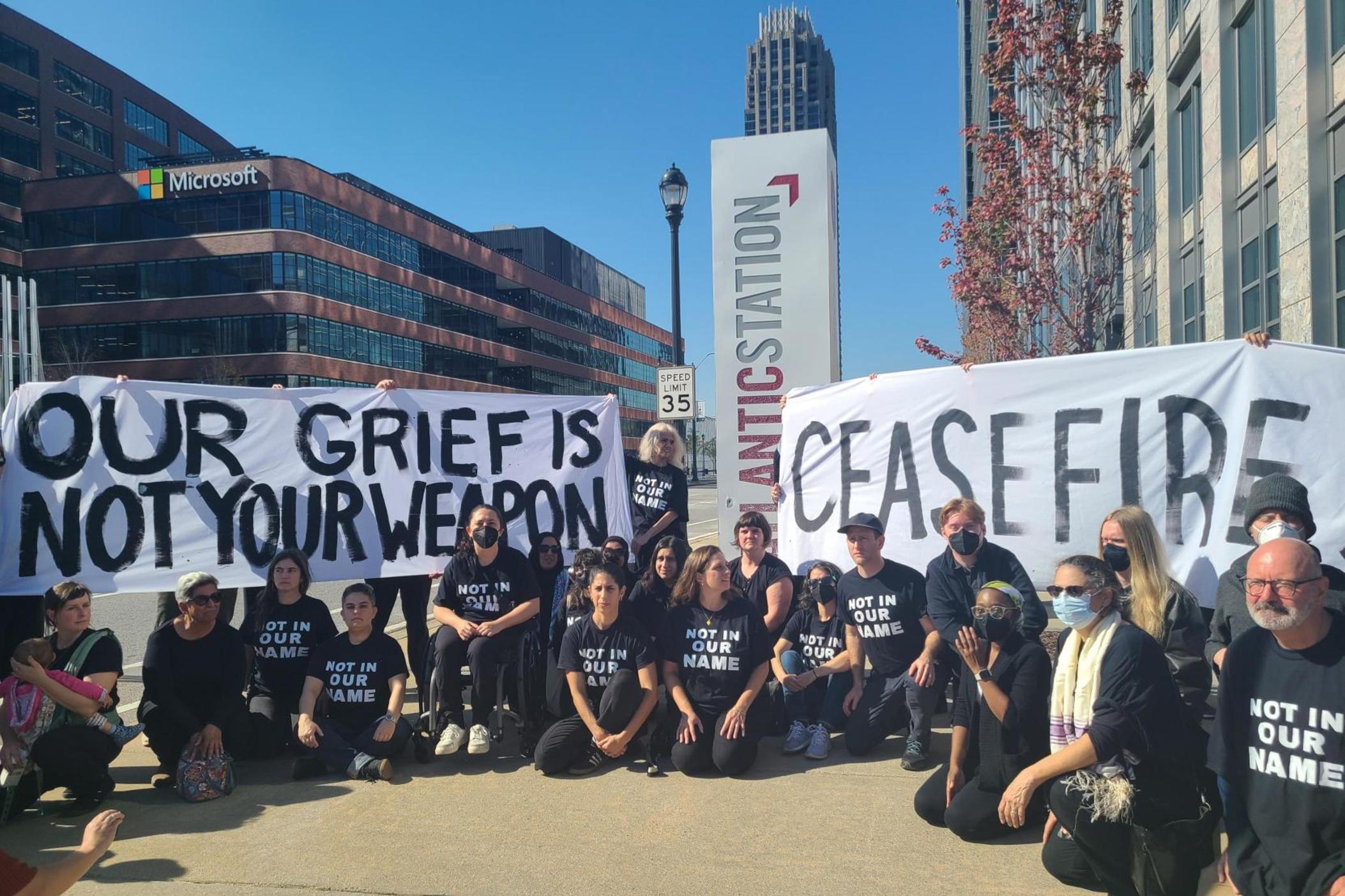 Organizers with Jewish Voices For Peace walked down 17th Street in Midtown Atlanta on Nov. 8, 2023, to protest outside Sen. Jon Ossoff's office. The group is demanding the Democrat call for a ceasefire in Gaza.