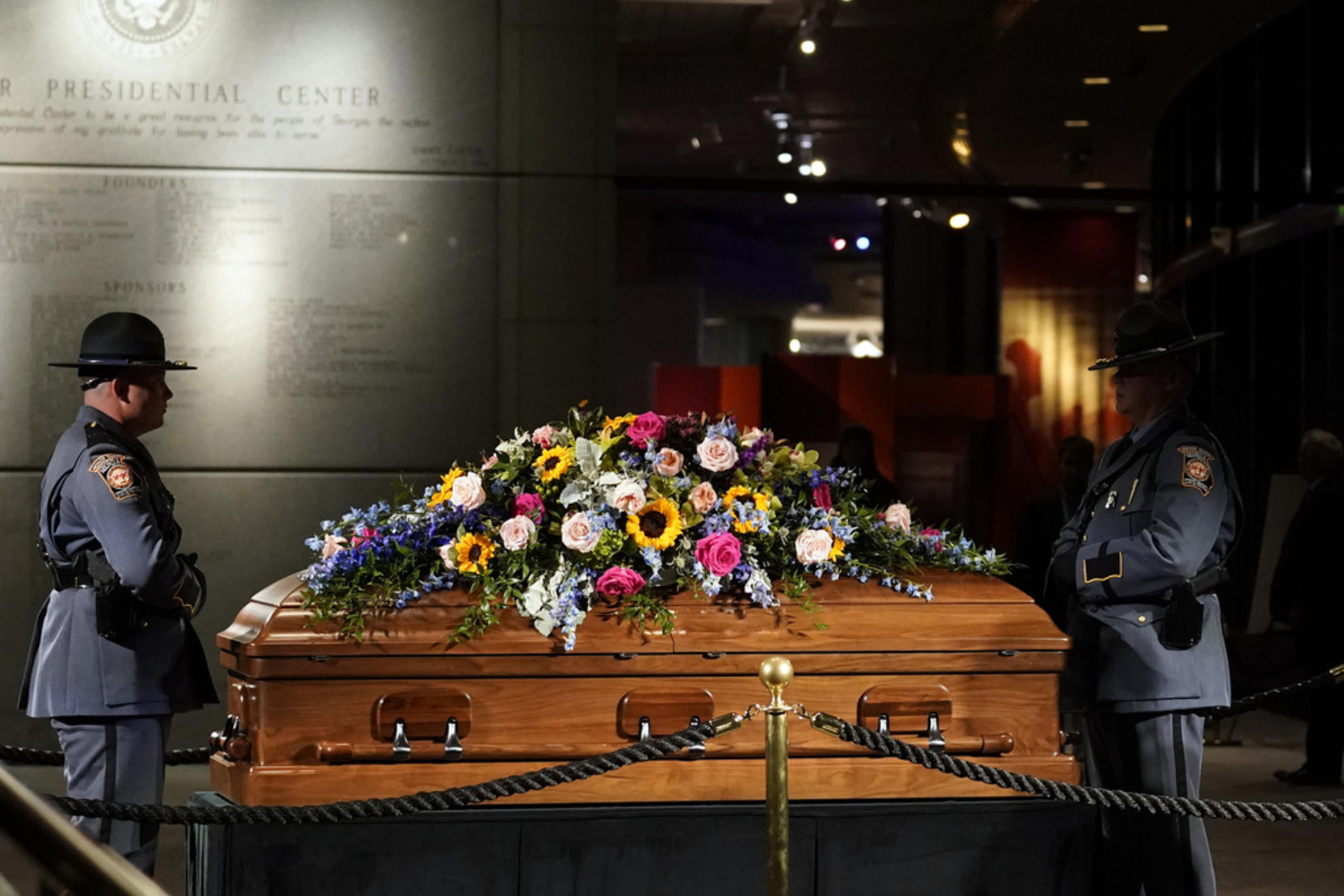 A Georgia State Patrol honor guard stands as members of the public pay respects to former first lady Rosalynn Carter at the Jimmy Carter Presidential Library and Museum in Atlanta, Monday, Nov. 27, 2023, during the public repose. 