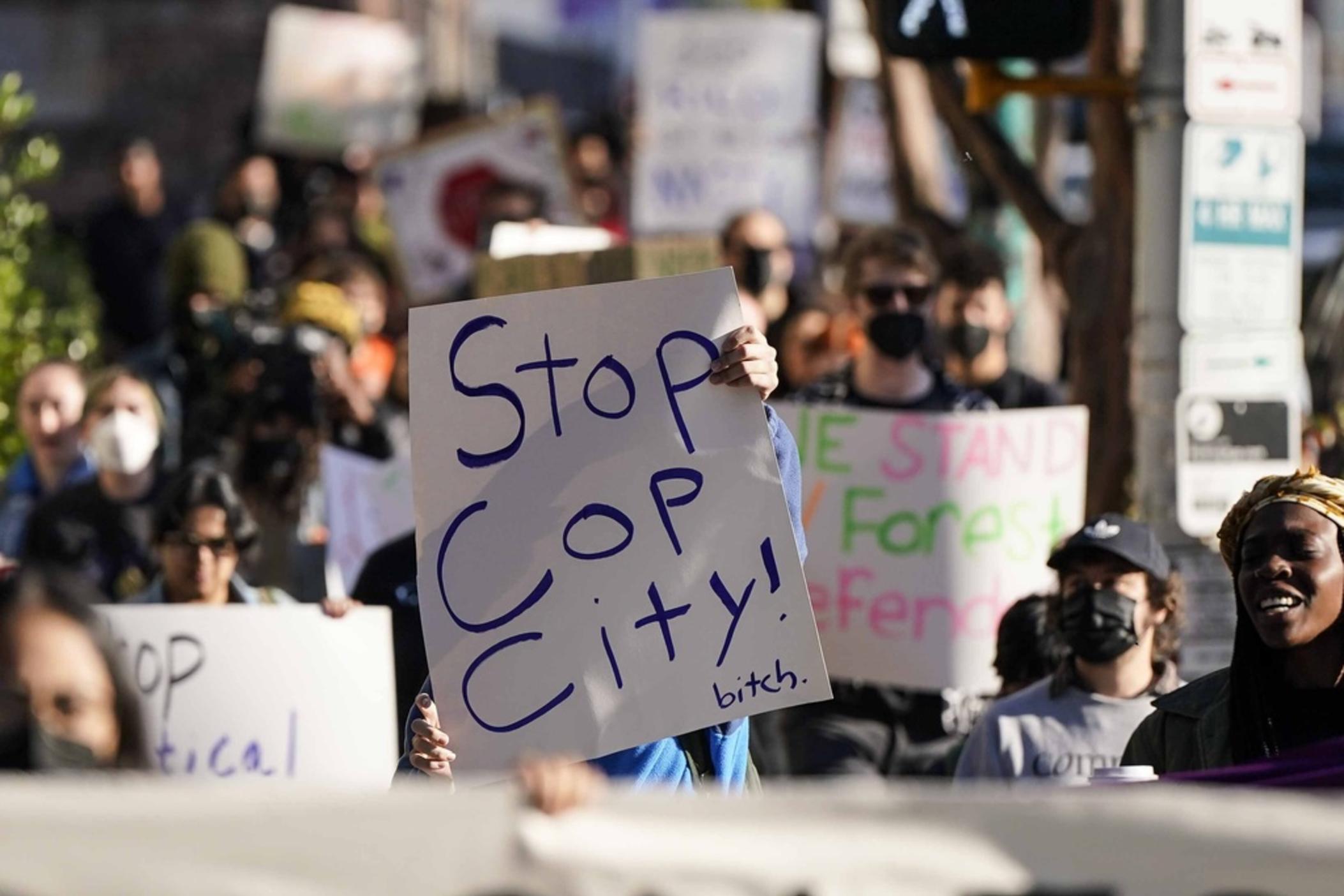 Demonstrators march to the courthouse supporting 61 defendants that are being arraigned on RICO charges related to vandalism at the site of the new Public Safety Training Center, outside the a Fulton County courthouse, Monday, Nov. 6, 2023, in Atlanta. 