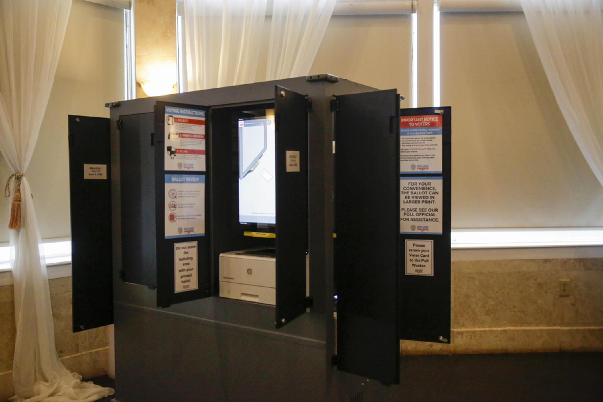 New state-issued voting machines used for the Georgia primary election on June 9, 2020, are seen at Park Tavern in Atlanta. U.S. District Judge Amy Totenberg issued a 135-page ruling late Friday, Nov. 10, 2023 in a long-running lawsuit filed by activists who want the state to ditch its electronic voting machines in favor of hand-marked paper ballots.