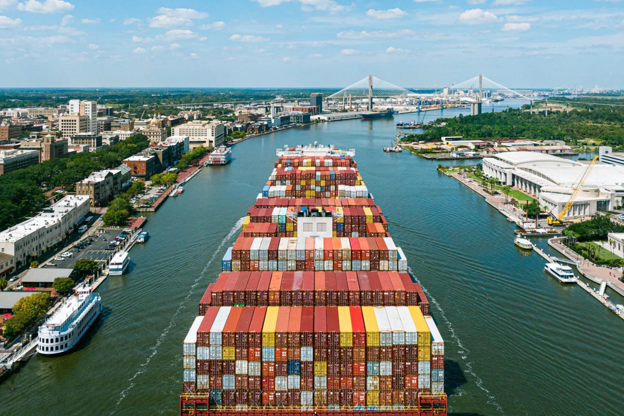 A large container ship passes by Savannah's River Street on it's way to the Georgia Ports Container Terminal. Credit: Justin Taylor/The Current