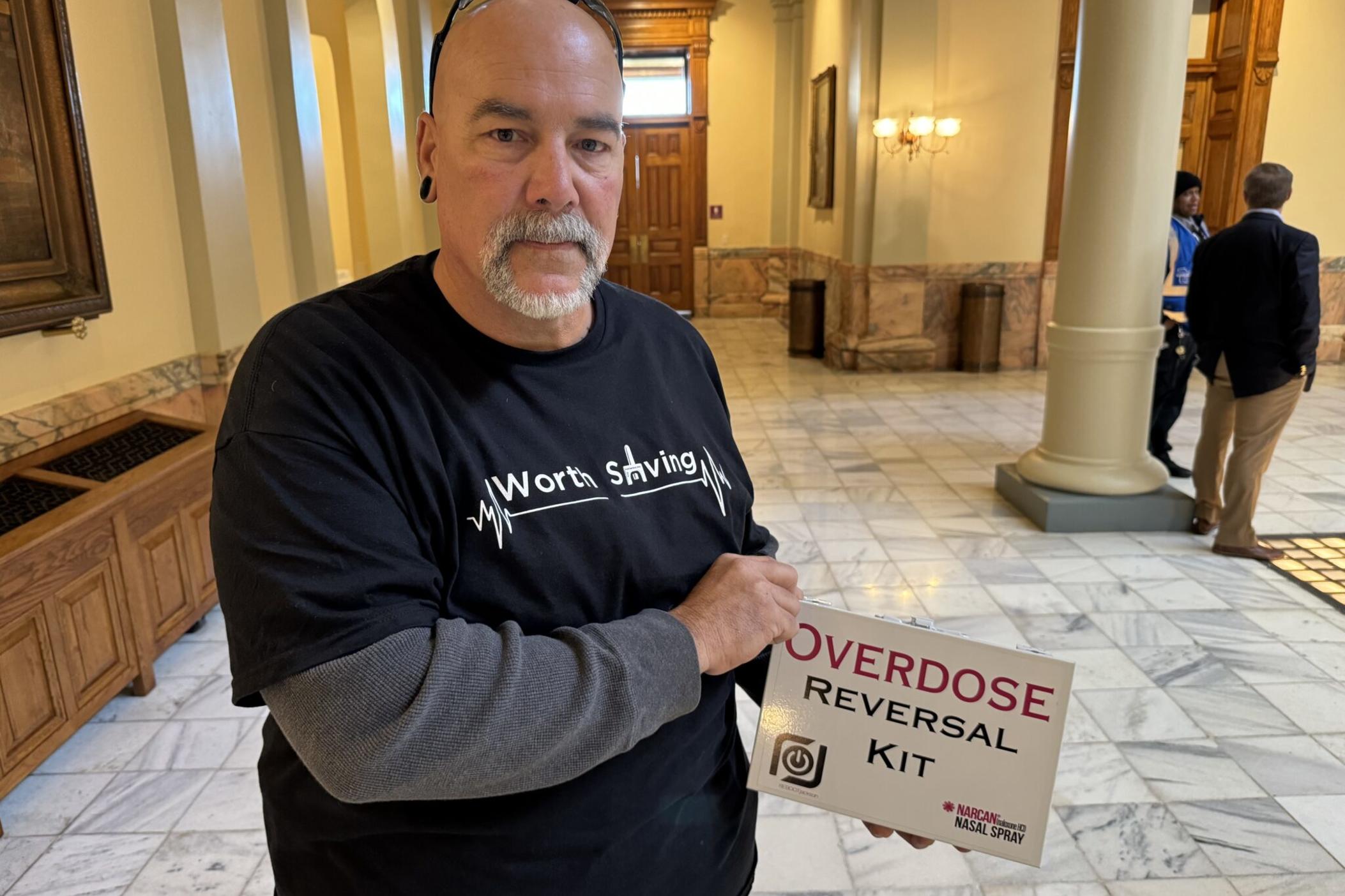 Jon Langston, founder and president of Reboot Jackson, which is a recovery community organization in Jackson County, displays a naloxone kit while at the state Capitol in January. Jill Nolin/Georgia Recorder
