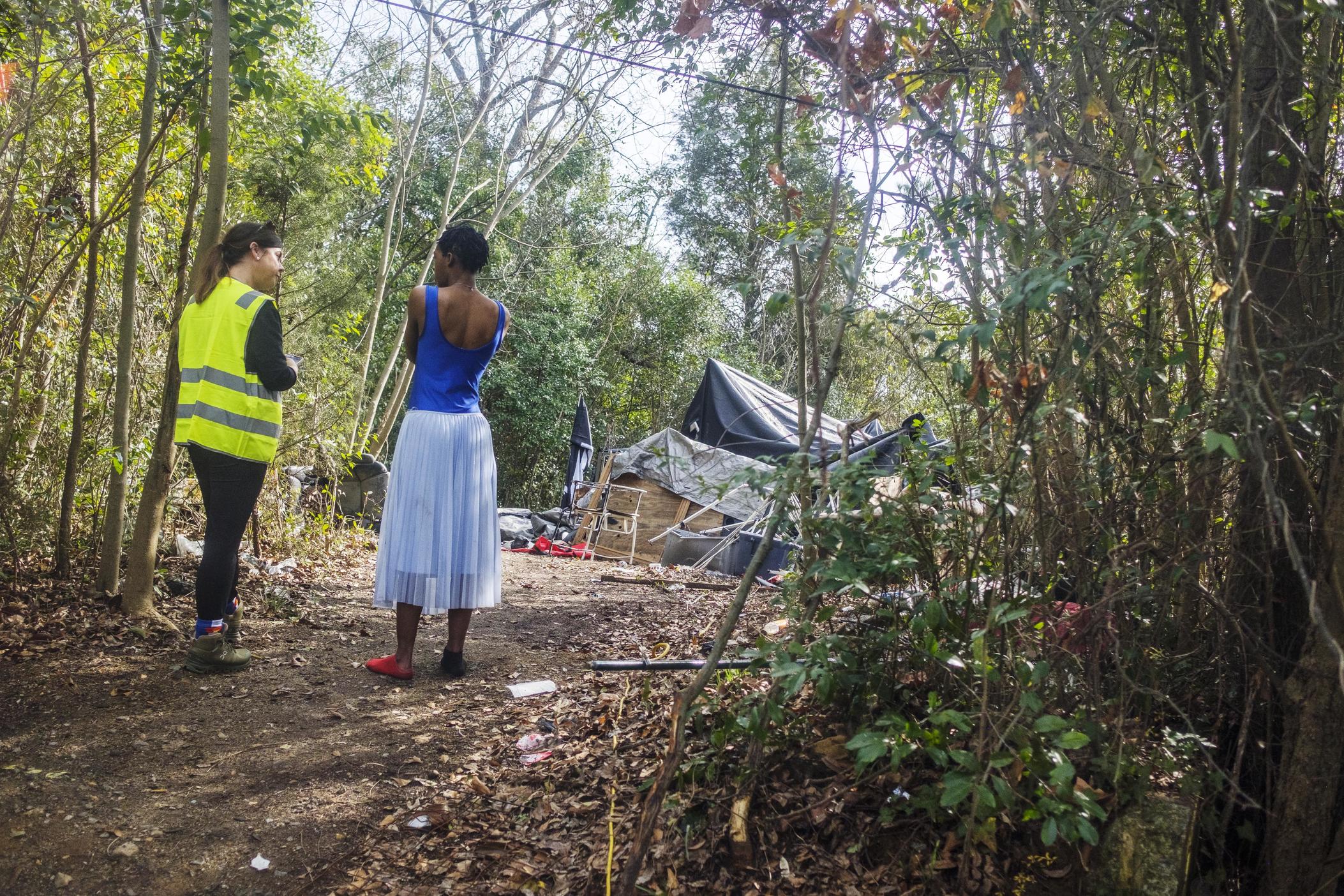 Heather Sims, left, conducts an interview at a homeless encampment in east Macon. The large encampment was little known to homeless service providers but well known to local firefighters who helped inform this year's Point in Time count. 