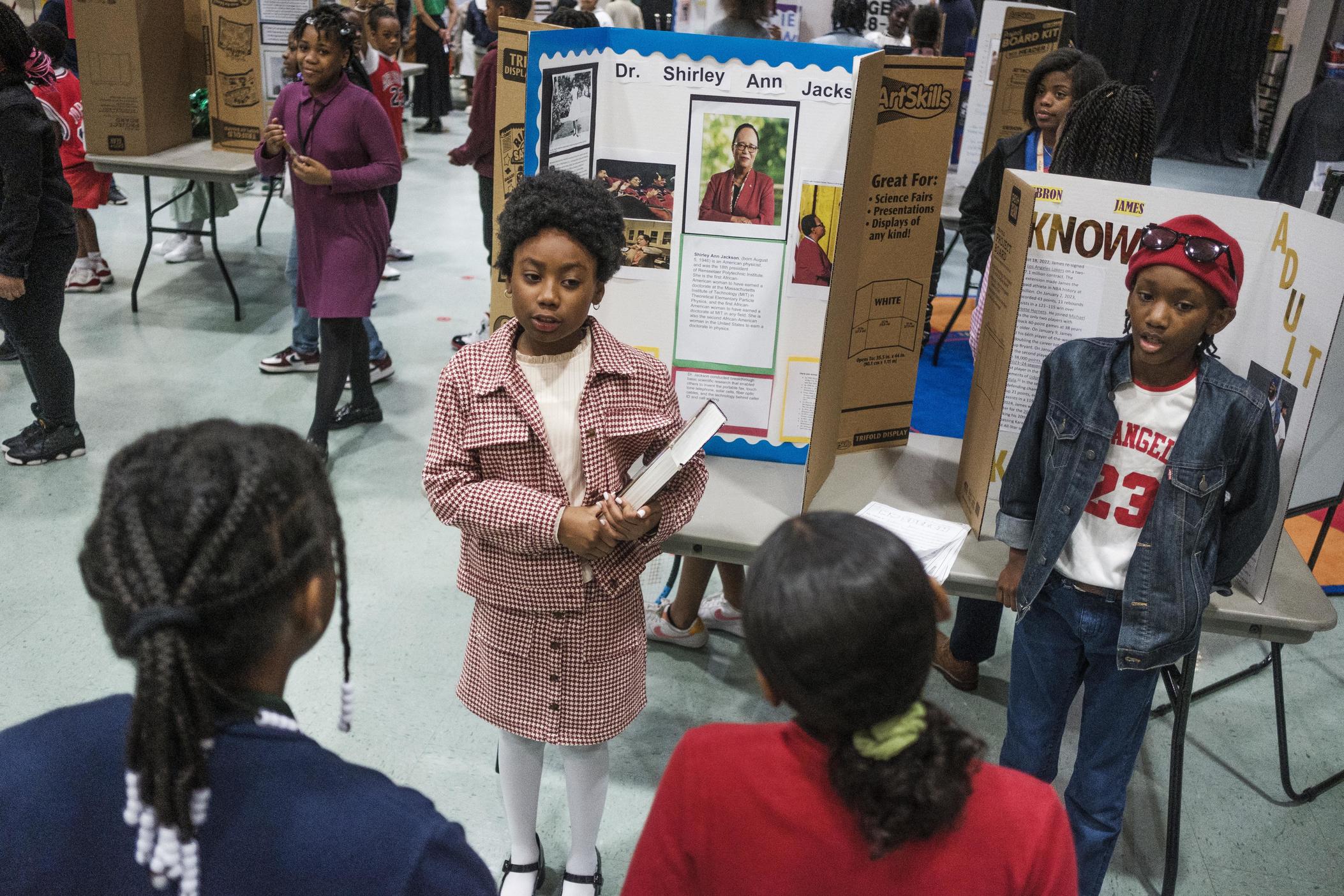 Harmony Johnson, a fourth grade student at Macon's Vineville Academy for the Arts, delivers the life story of physicist Dr. Shirley Ann Jackson during the school's recent Living Black History Museum event. 