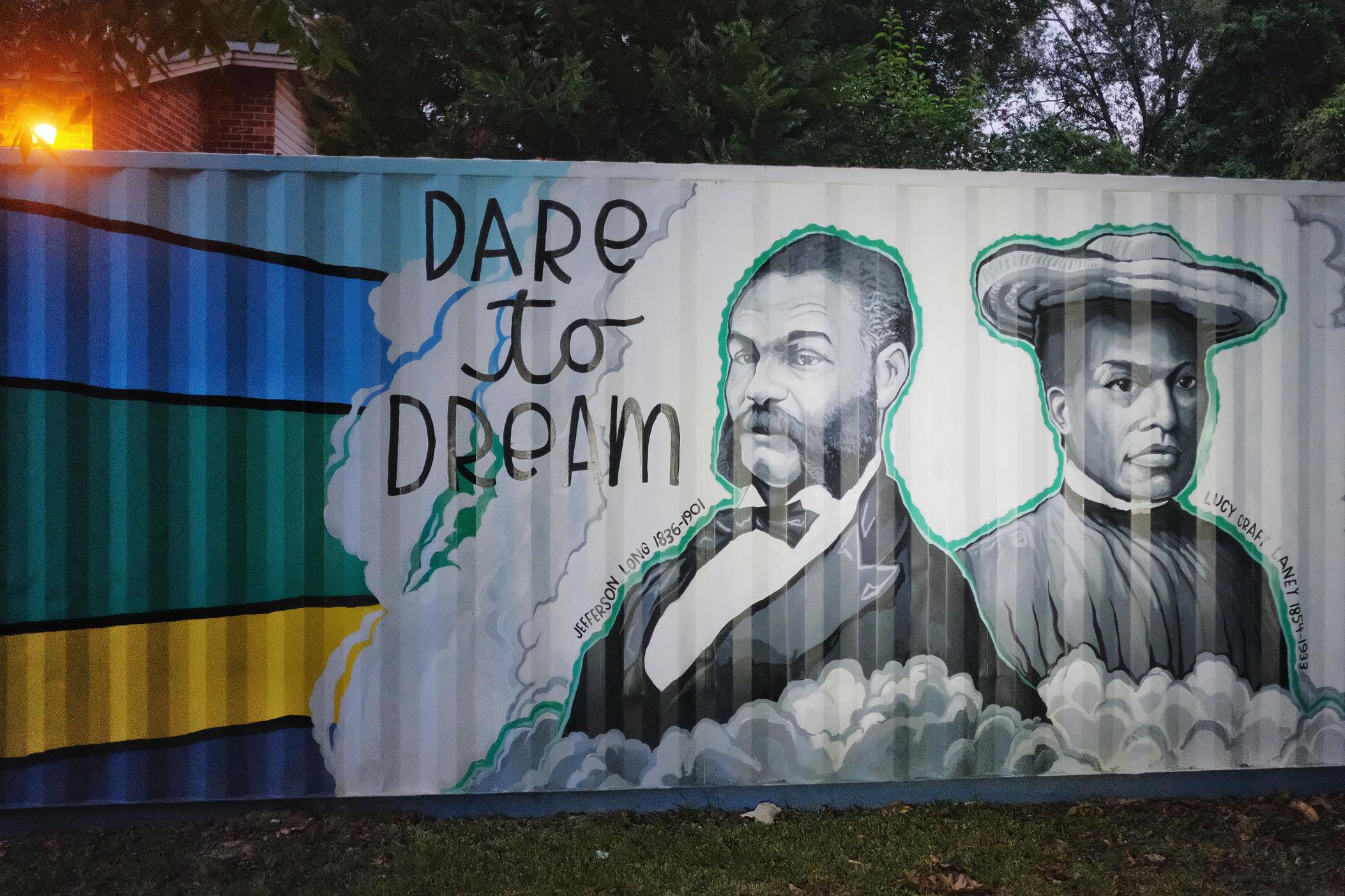 U.S. Rep. Jefferson Long (left), the first Black congressman of Georgia, and pioneering educator of Black children Lucy Craft Laney (right) are depicted in a mural by artist Kevin Lewis in Macon's Pleasant Hill neighborhood which both at one time called home.